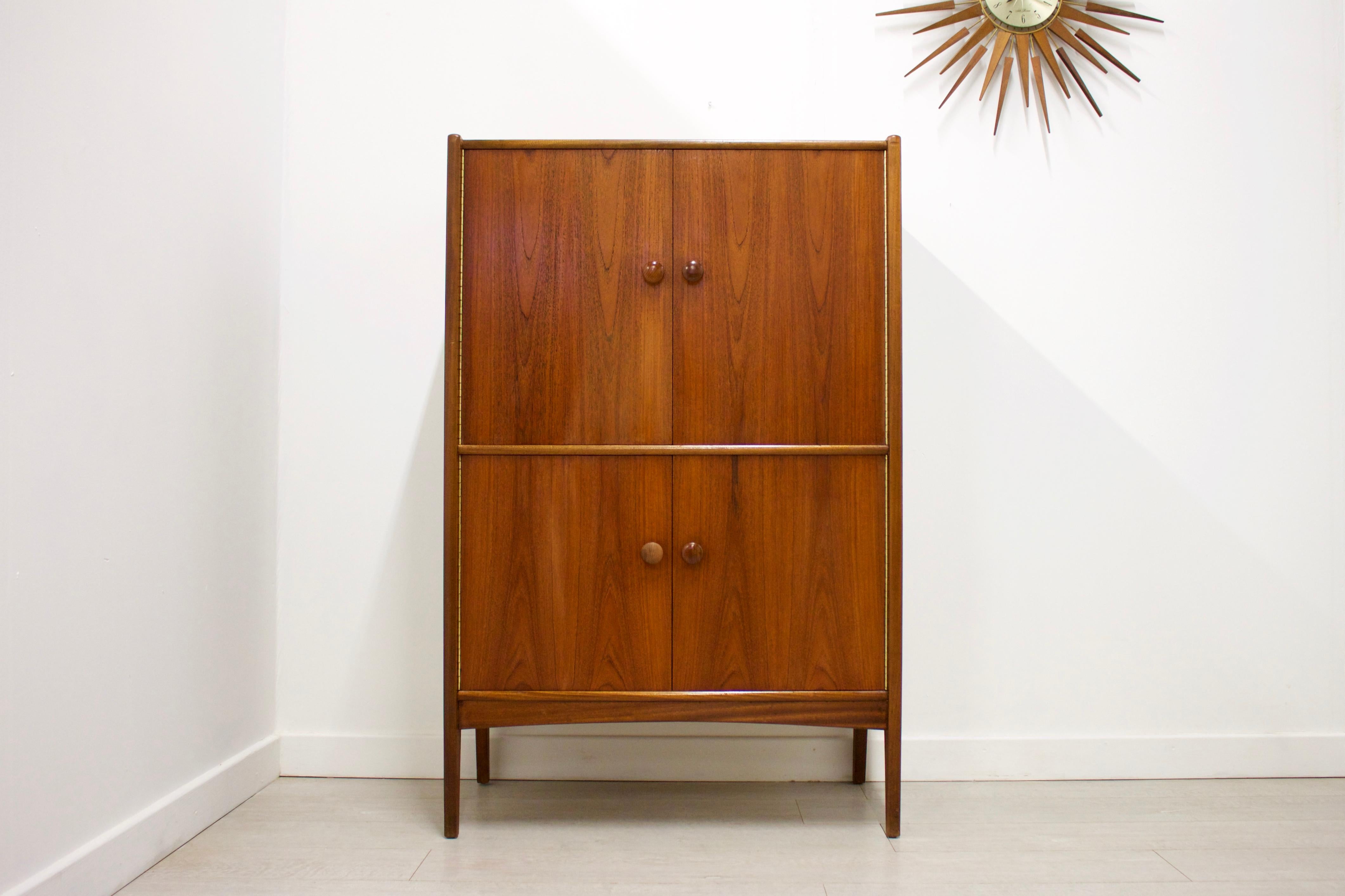 Midcentury design

- Midcentury drinks cabinet / dry bar / sideboard
- Manufactured in the UK by Younger
- Made from teak and teak veneer.