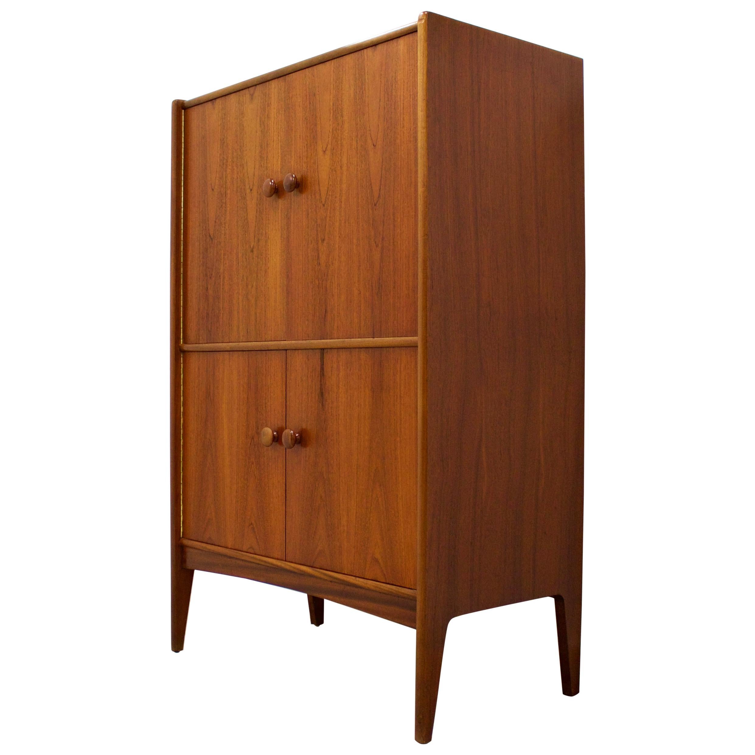 Midcentury design

- Midcentury drinks cabinet / dry bar / sideboard
- Manufactured in the UK by Younger
- Made from teak and teak veneer.
