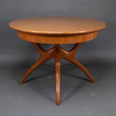 Mesa de comedor extensible de teca de mediados de siglo con patas en cruz de estilo orgánico