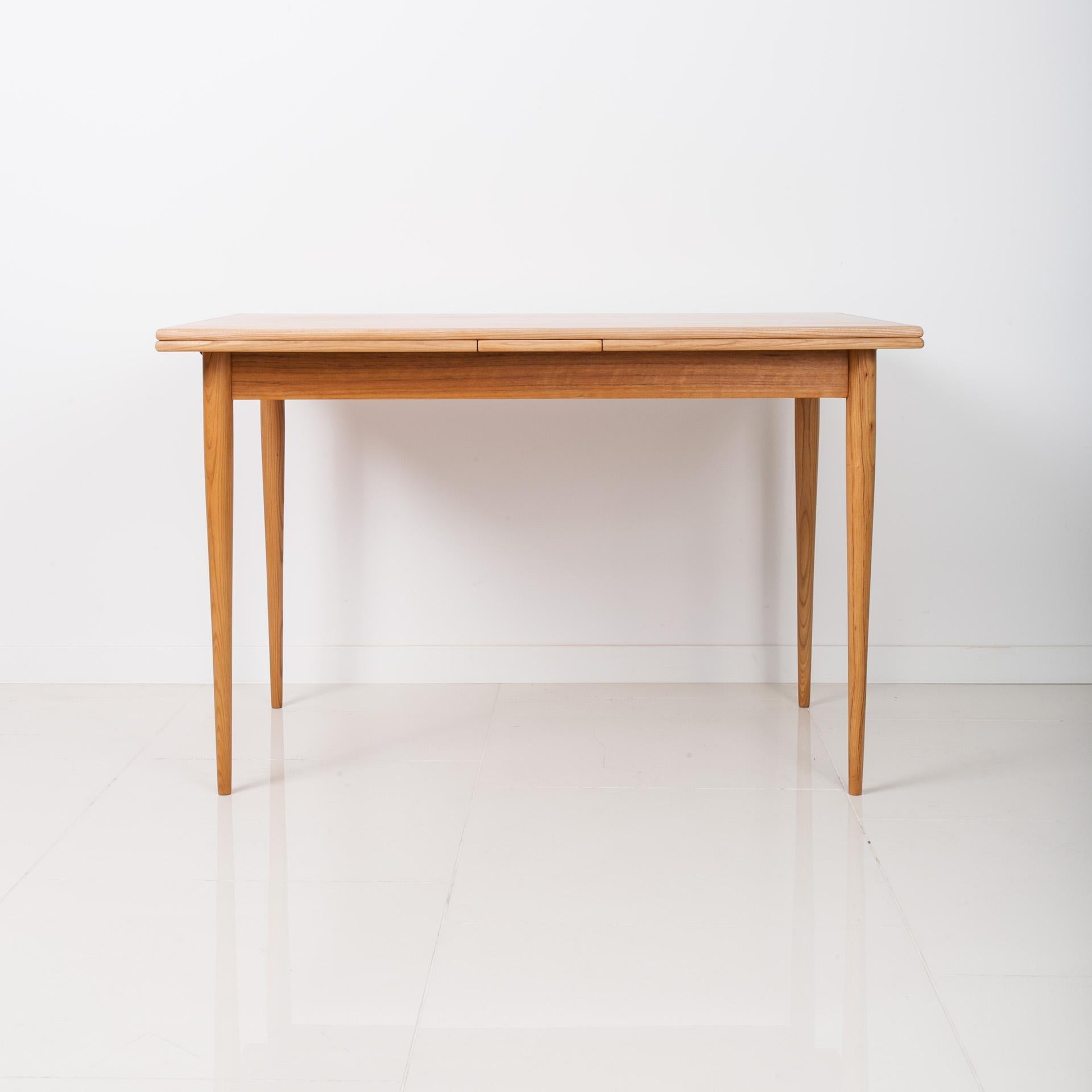 This beautiful coffee table was made in the 1960s. It features 4 slender legs and top made of teak wood. It is a perfect example of top-quality Danish design and great craftsmanship. The piece is professionally renovated – old coatings have been