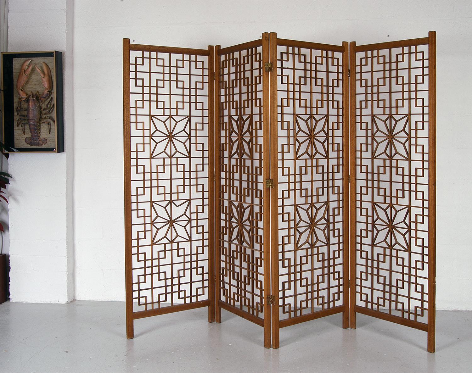 This wonderful four-panel folding wooden screen makes for a very elegant room divider. The Japanese woodwork art of Kumiko is a precise method of assembling wood pieces without glue or nails, where individual slats are cut and fitted together using