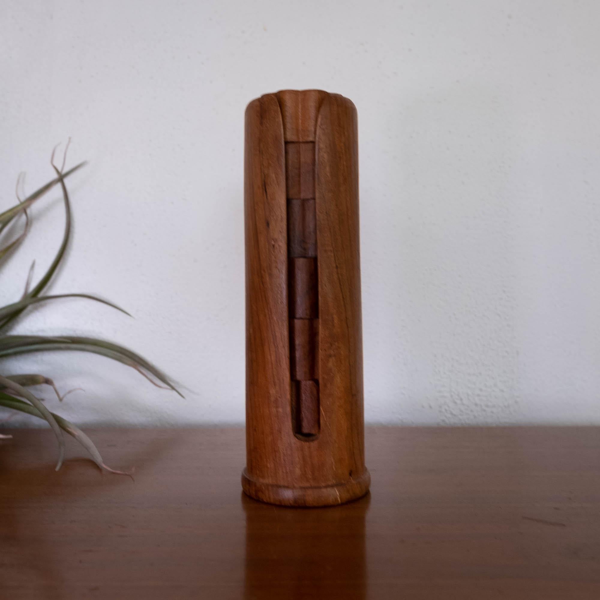 A set of six napkin rings in a stand. Teak, 1960s.