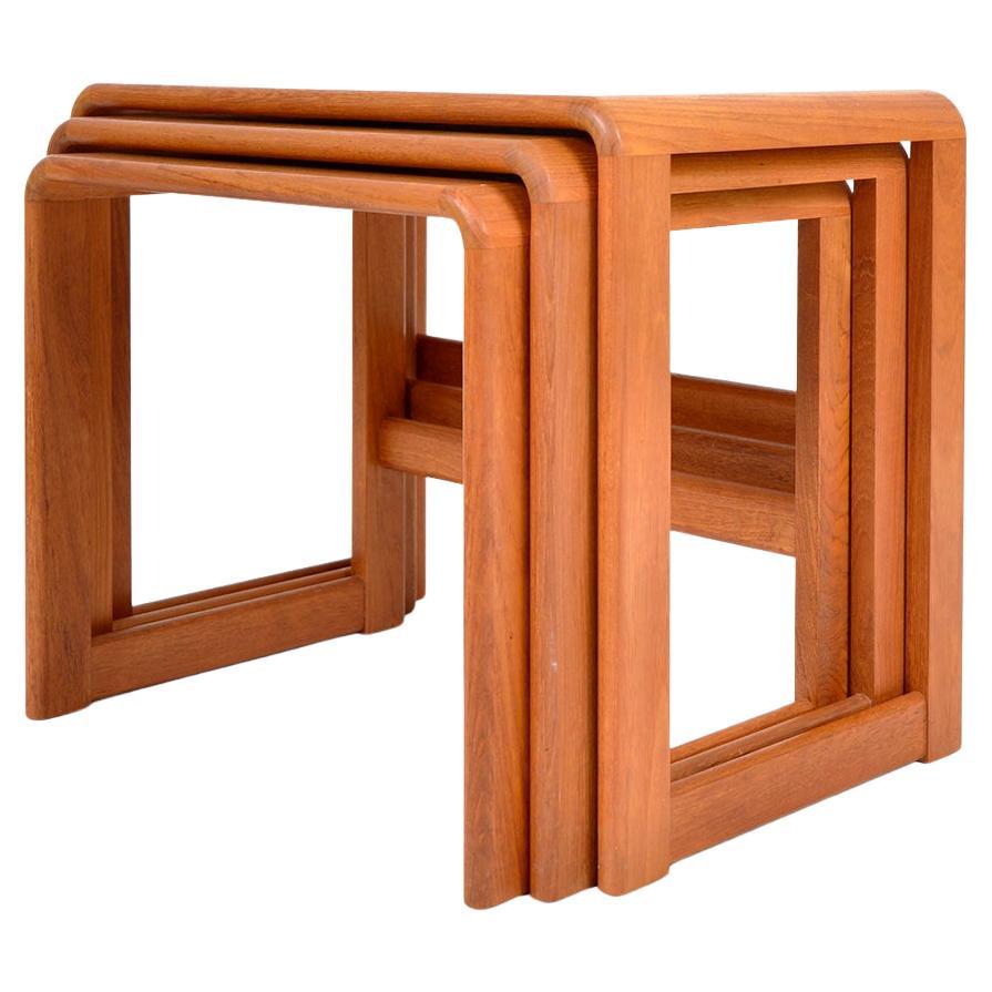 A very stylish nest of three solid teak side tables by O'Donnell Design, Ireland c.1970, of rectangular and curved form, raised on lower stretchers with a lovely grain. The set is beautifully designed from every angle with good proportions, sharp