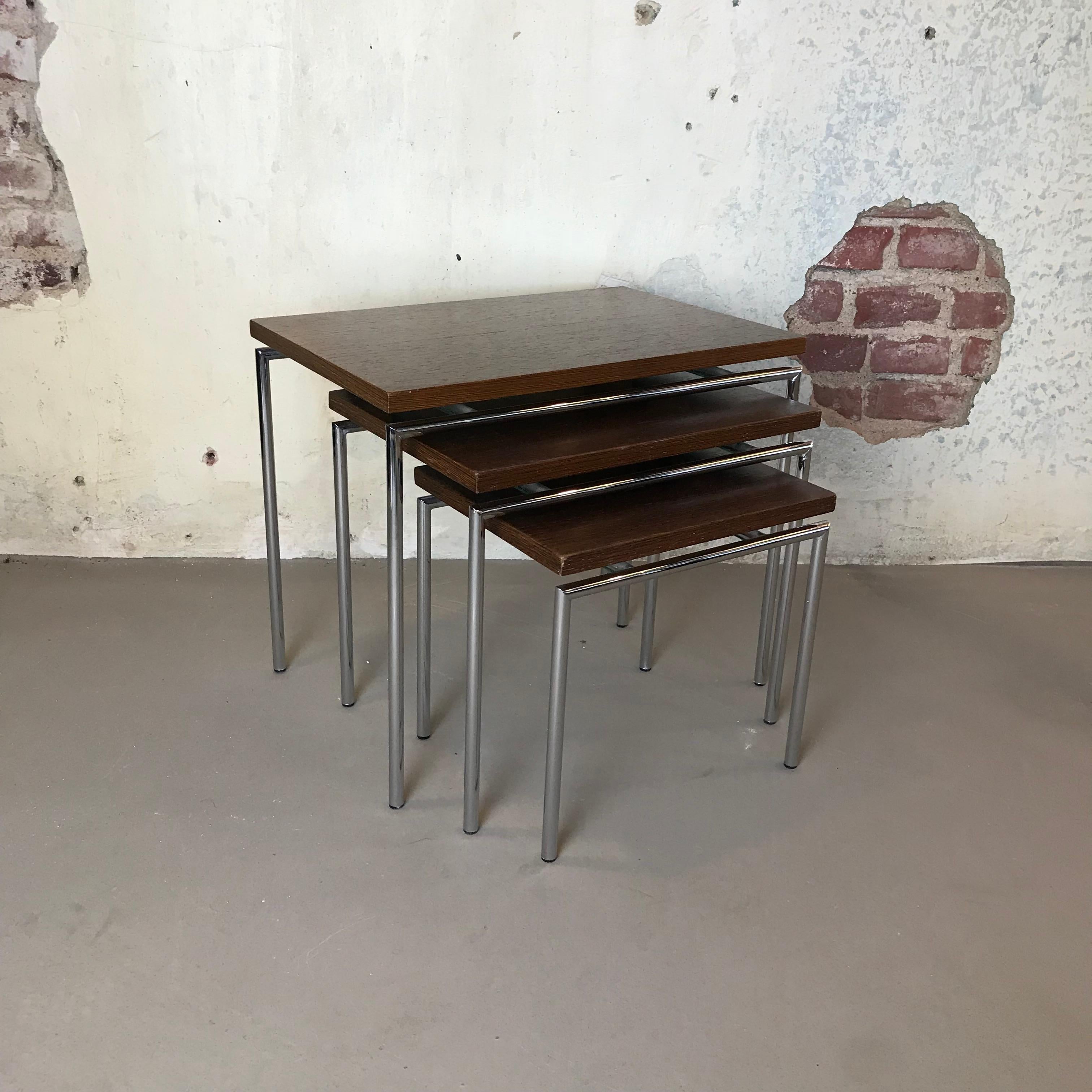 Beautiful set of 3 teak nesting tables designed by Cees Braakman for Pastoe. Teak veneer tops on a chrome plated base. Minimalistic Dutch design. Good vintage condition with little signs of age and use.
Large: 45 x 30 Height 38
Medium: 37 x 27