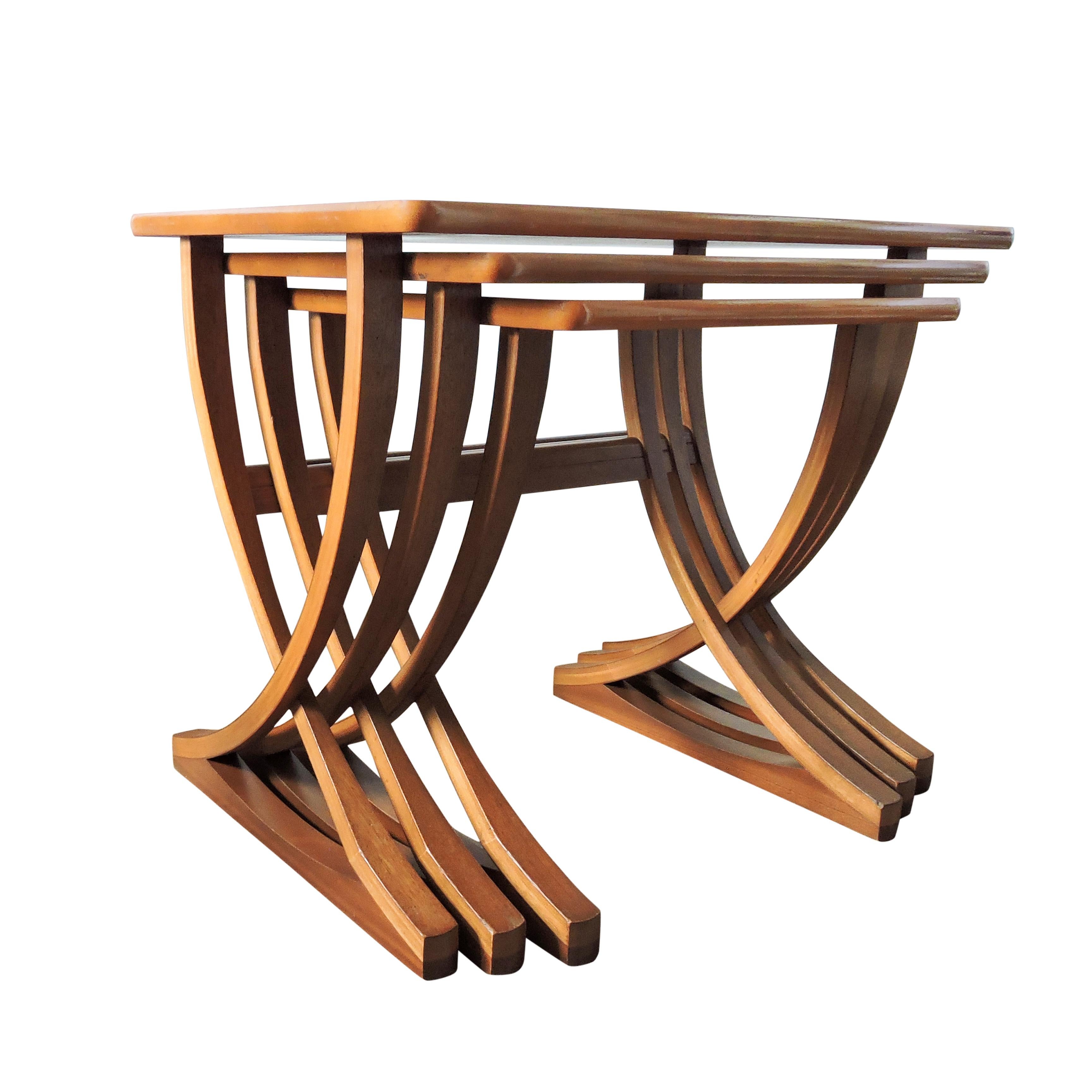 This set of 3 teak nesting tables was manufactured by Nathan.