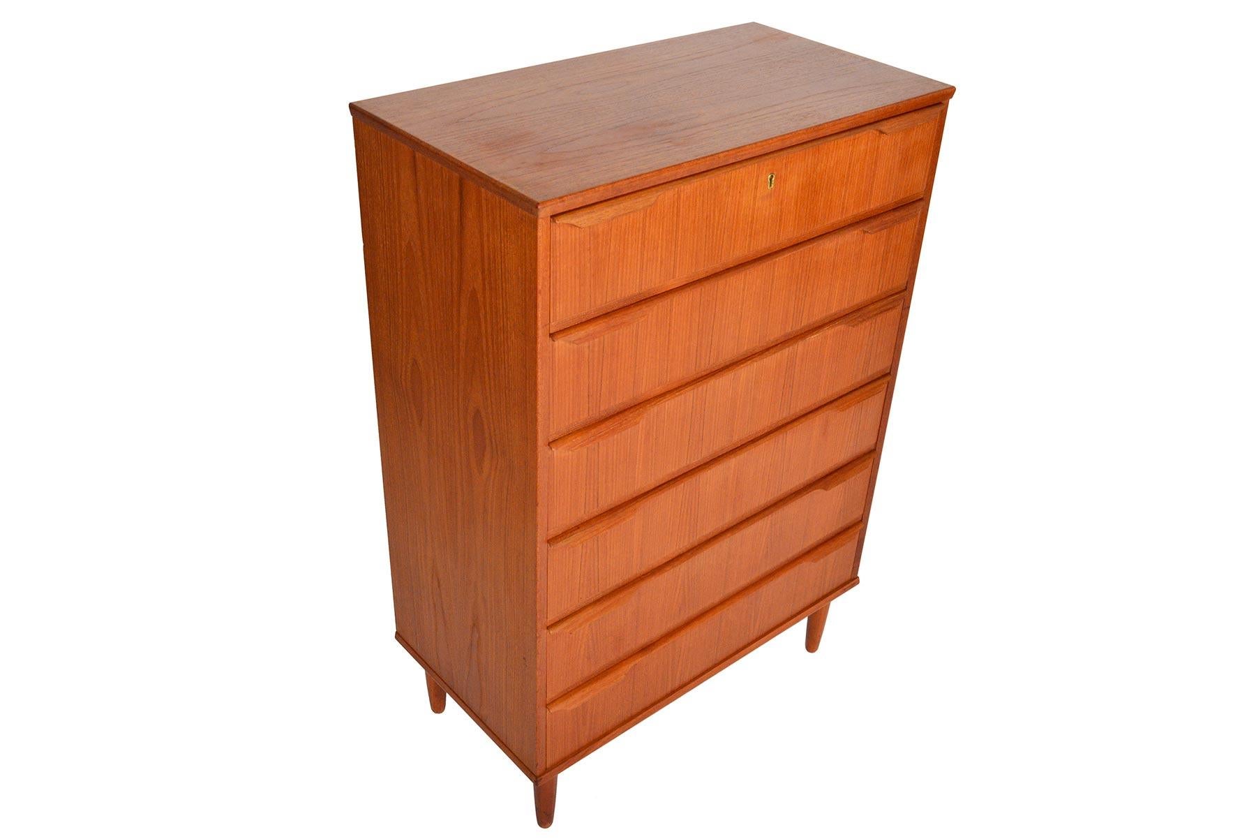 This stately Danish modern six-drawer teak highboy dresser by Trekanten is a rare find. Rich woodgrain and sculpted quarter- profile pulls define this piece. In excellent original condition with typical wear for its vintage.
 