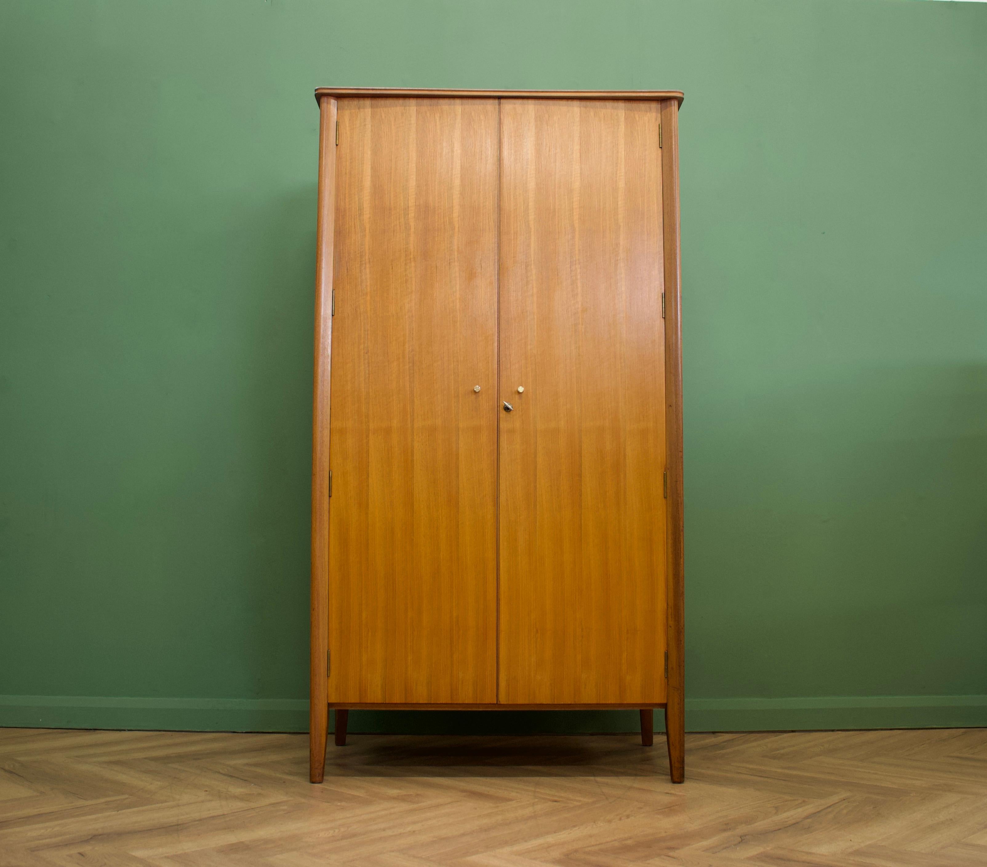 Mid-Century Modern wardrobe
Manufactured by Younger in the UK 
Made from Teak & Teak Veneer
Featuring a hanging rail and a shelves.