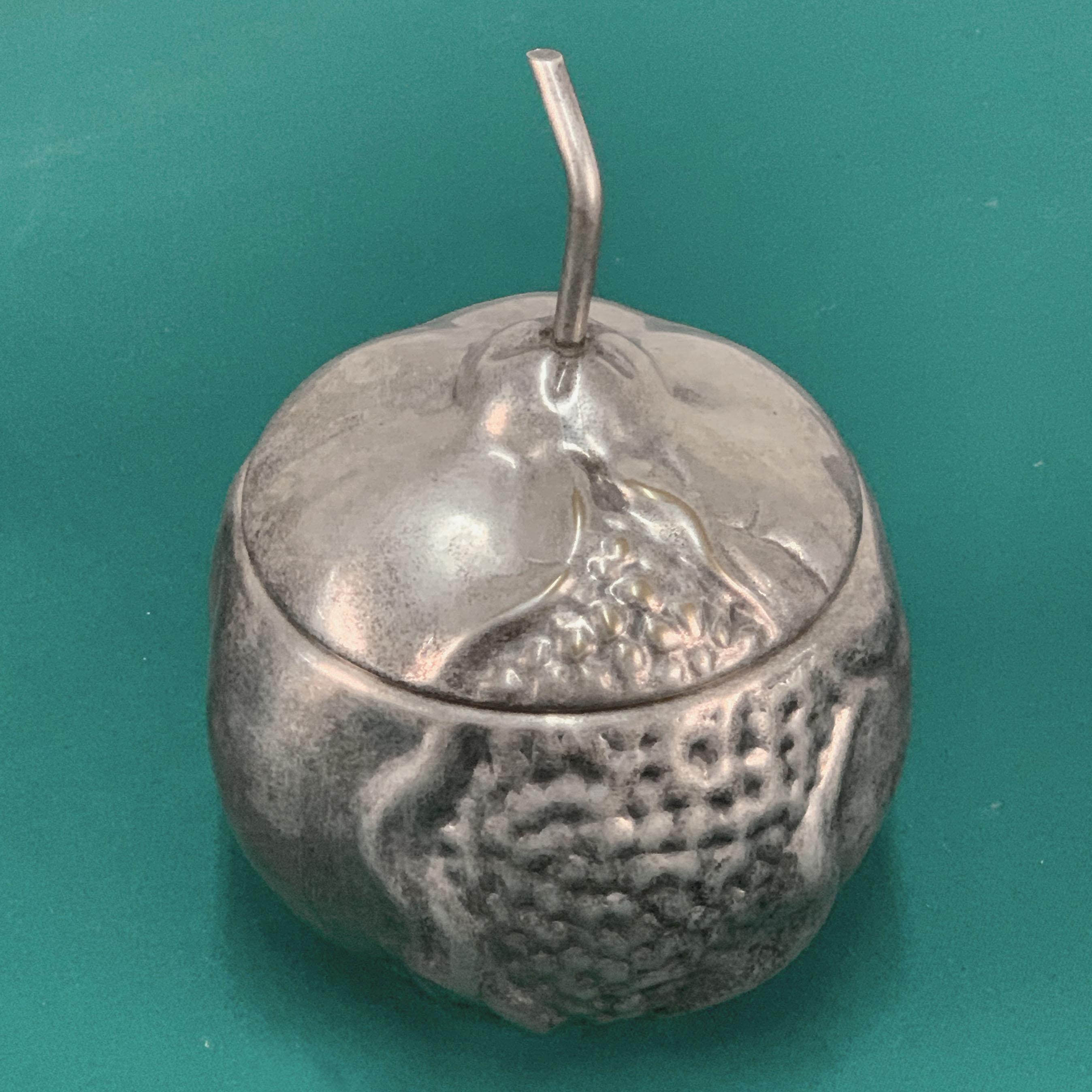 A wonderful midcentury silver plate wine cooler produced in Florence, Italy during the 1960s by Teghini Firenze.

It has the shape of pomegranate and of two pieces, the top can be removed by pulling the petiole.

A wonderful, stylish and elegant