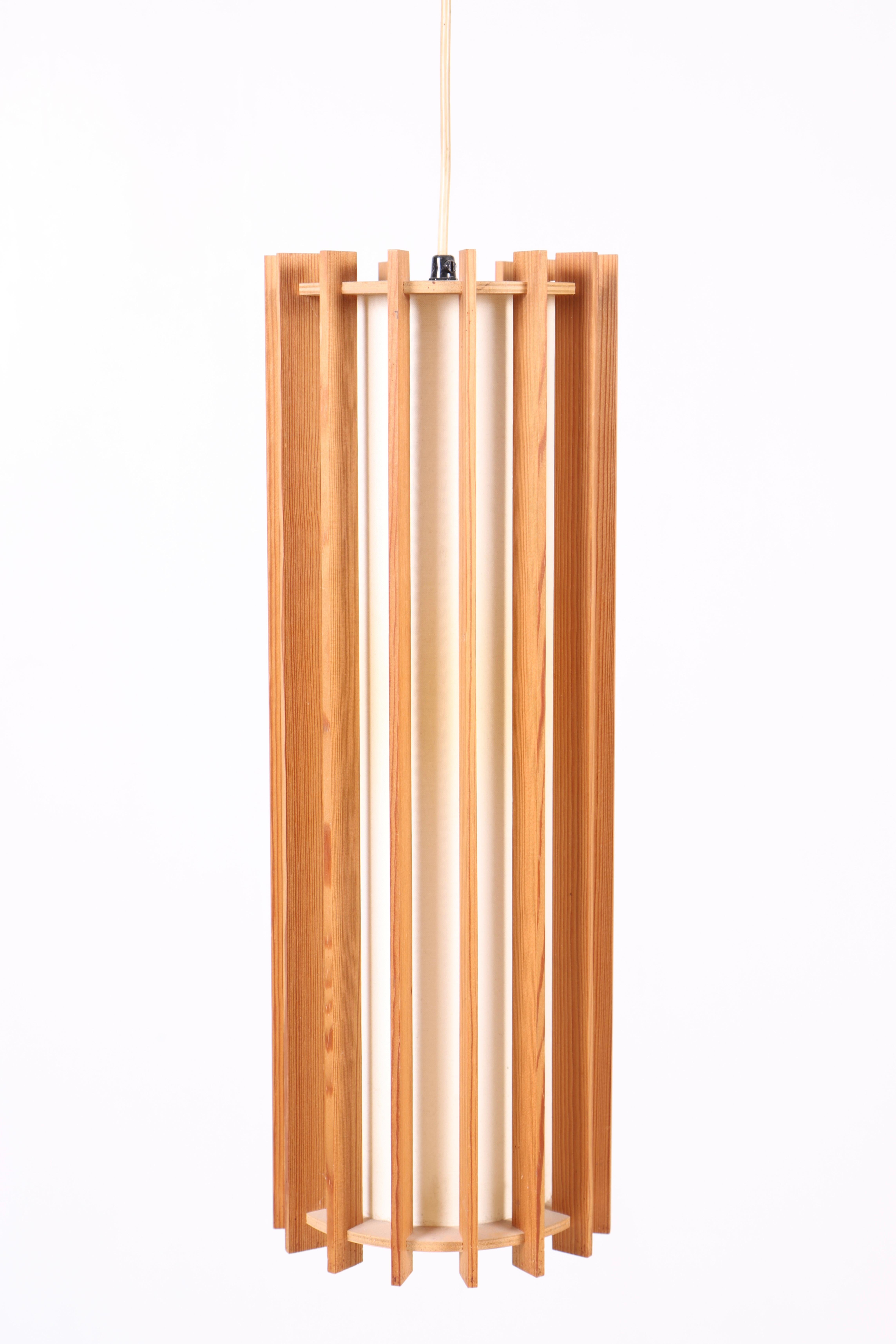 Ceiling lamp in pine, designed by Ib Fabiansen for Fog & Mørup in Denmark. Great original condition.