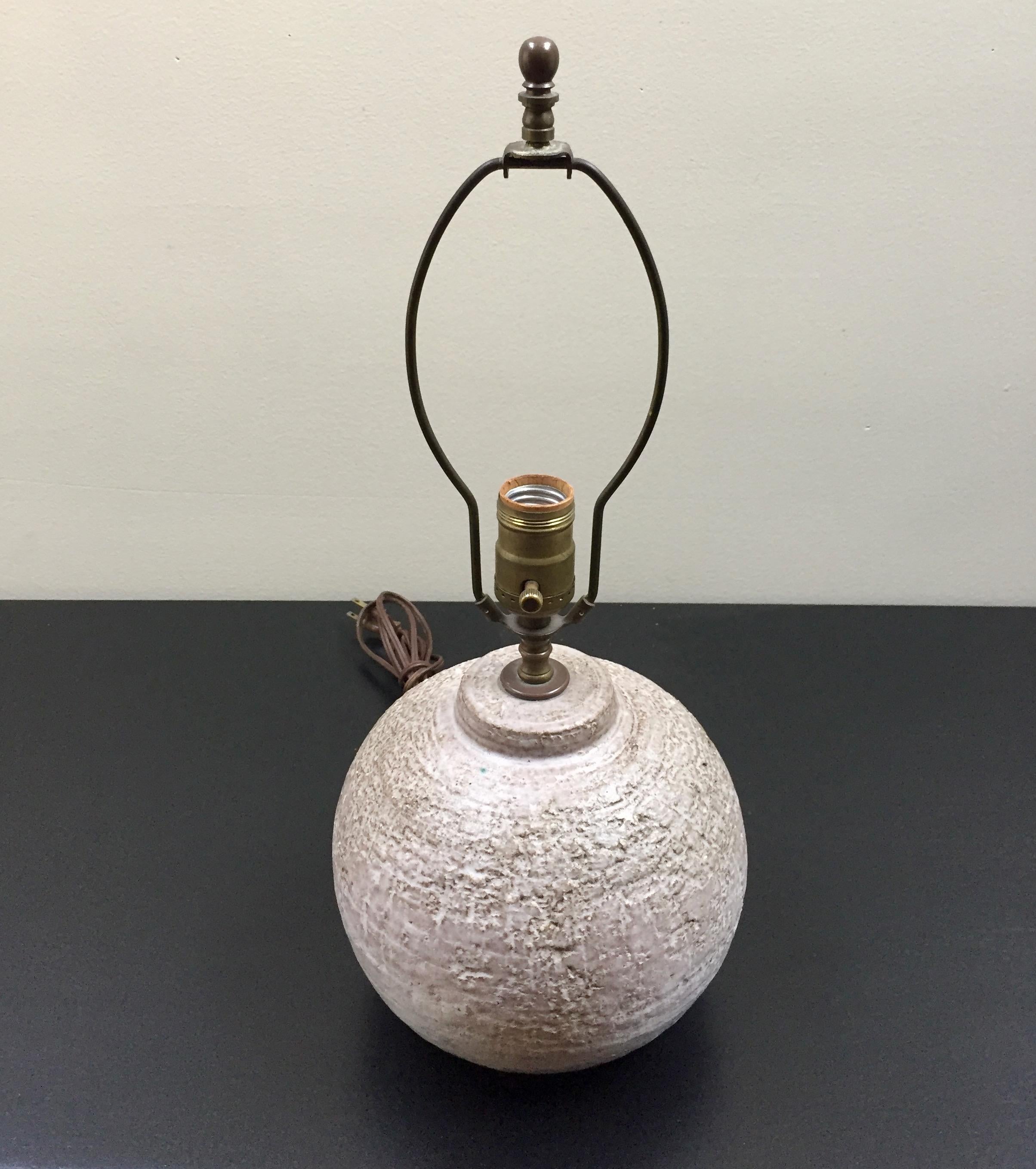 Lovely oatmeal colored heavy textured ceramic lamp in the style of Design Technics.