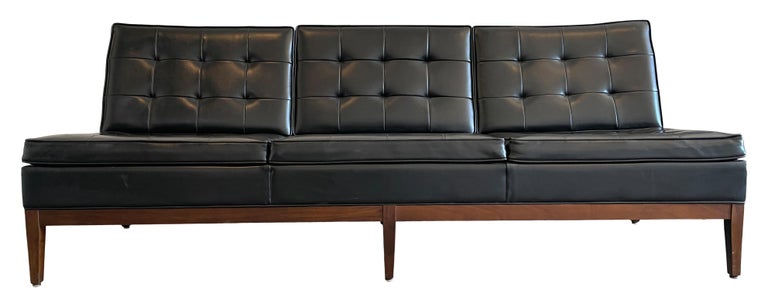 Beautiful vintage circa 1950 midcentury Thonet sofa three-seat sofa in the style of Florence Knoll for Thonet USA Manufacturer. Solid walnut frame has original Black Vinyl upholstery cushions with original Thonet tag under sofa. In good vintage