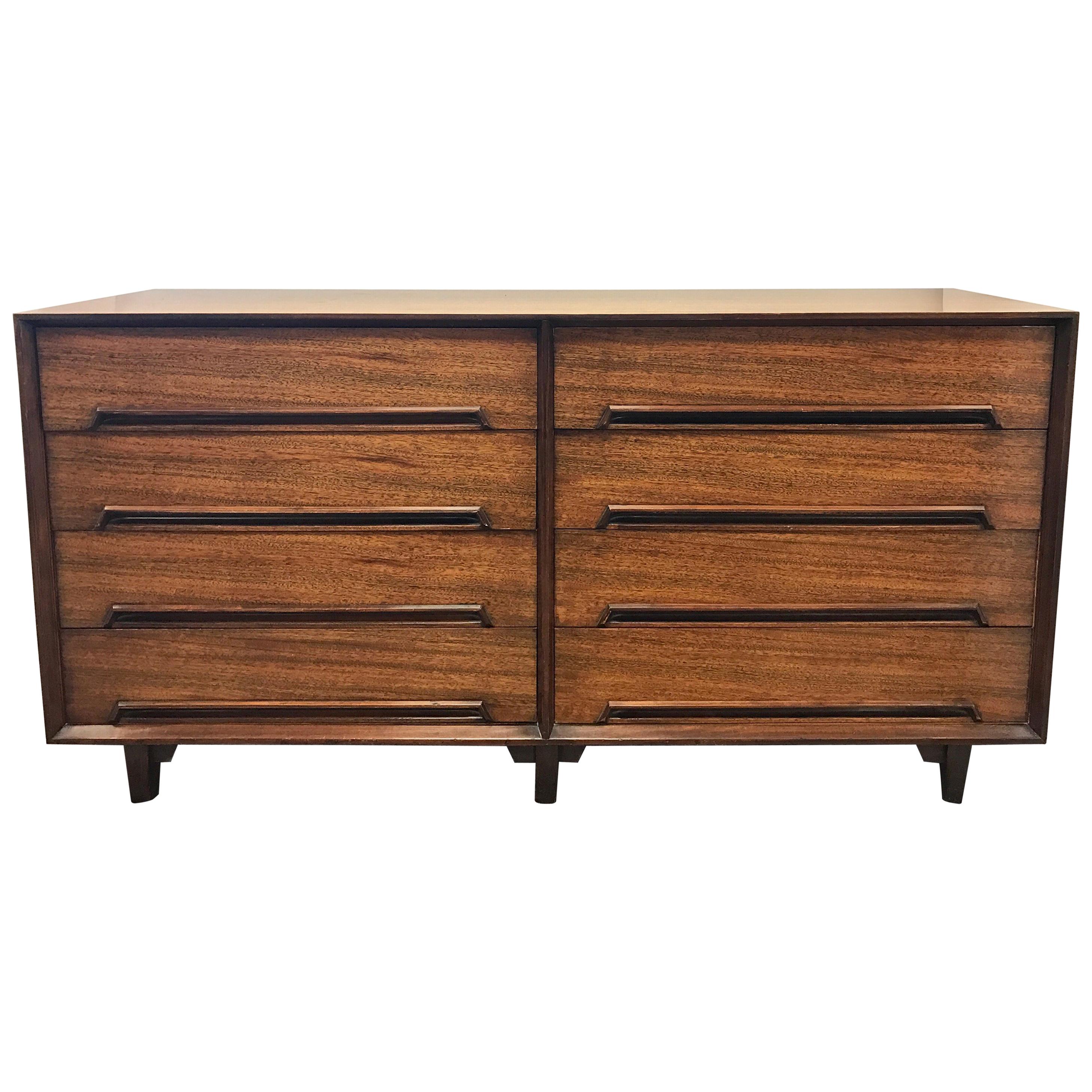 Milo Baughman for Drexel perspective mahogany and rosewood three-piece bedroom set includes a tall five-drawer chest of drawers. Measures: H 45 in x W 42 in x D 19
Large eight-drawer double dresser H 32 in x W 63 in x D 19 in
Full size headboard