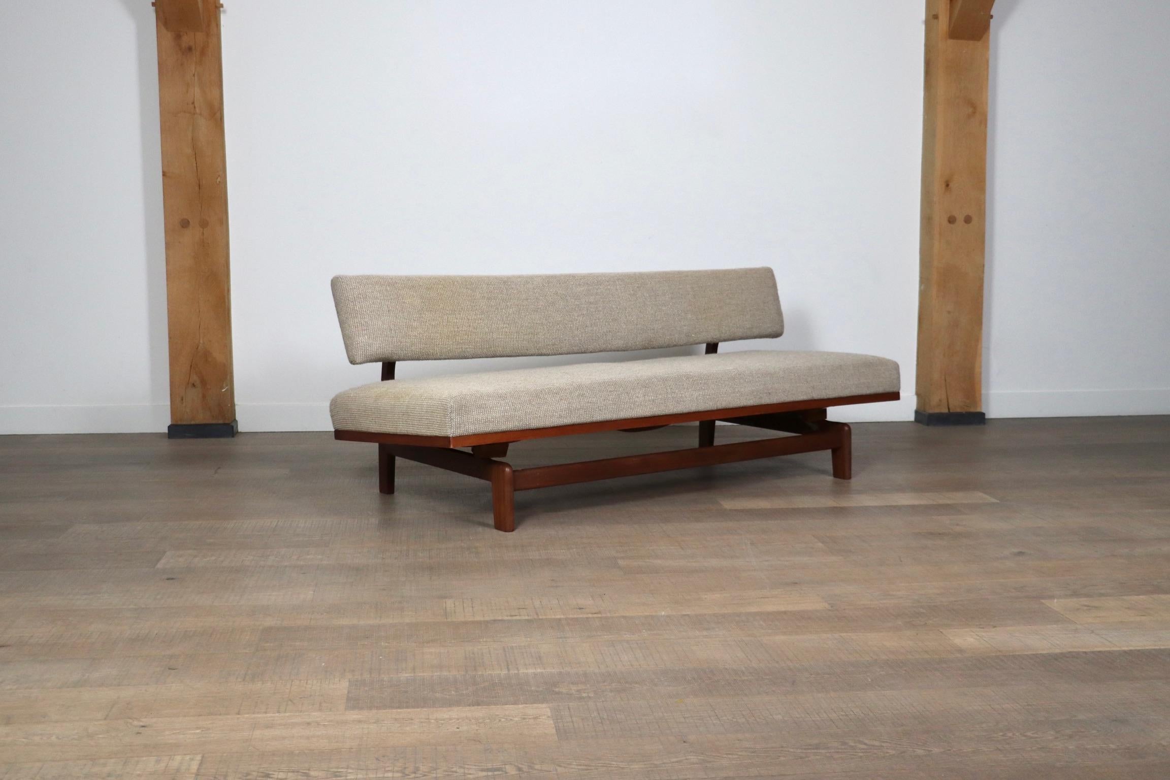 Beautiful teak wooden sofa which can be extended into a daybed by Hans Bellmann, and produced by Wilkhahn in Germany. The sophisticated design of the wooden frame makes the sofa visually pleasing from any side, and especially the backside. Still