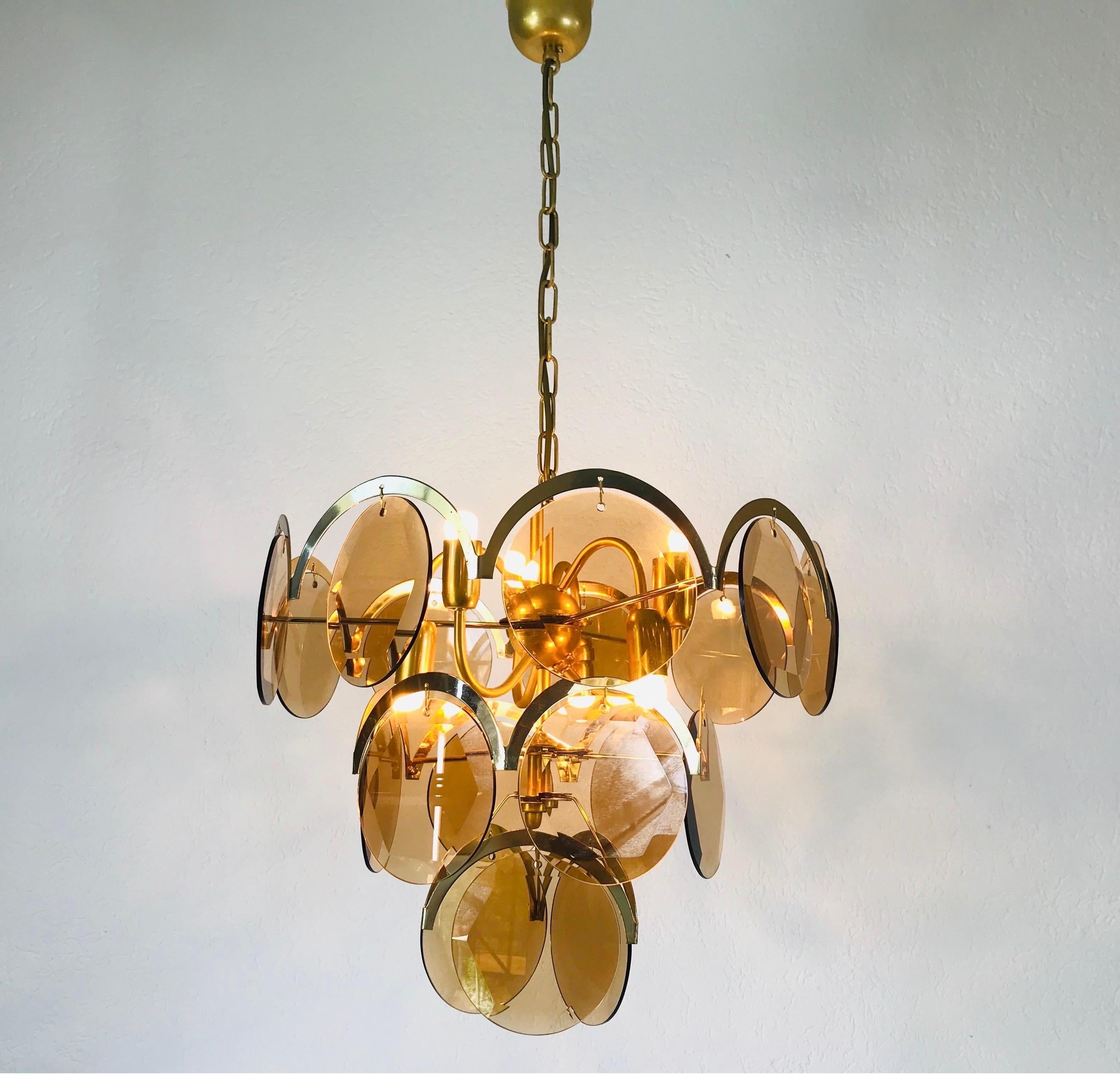 A midcentury chandelier made in Italy in the 1960s. It is fascinating with its colorful glasses and chrome body.

The light requires E14 light bulbs. Very good vintage condition.

Free worldwide express shipping.