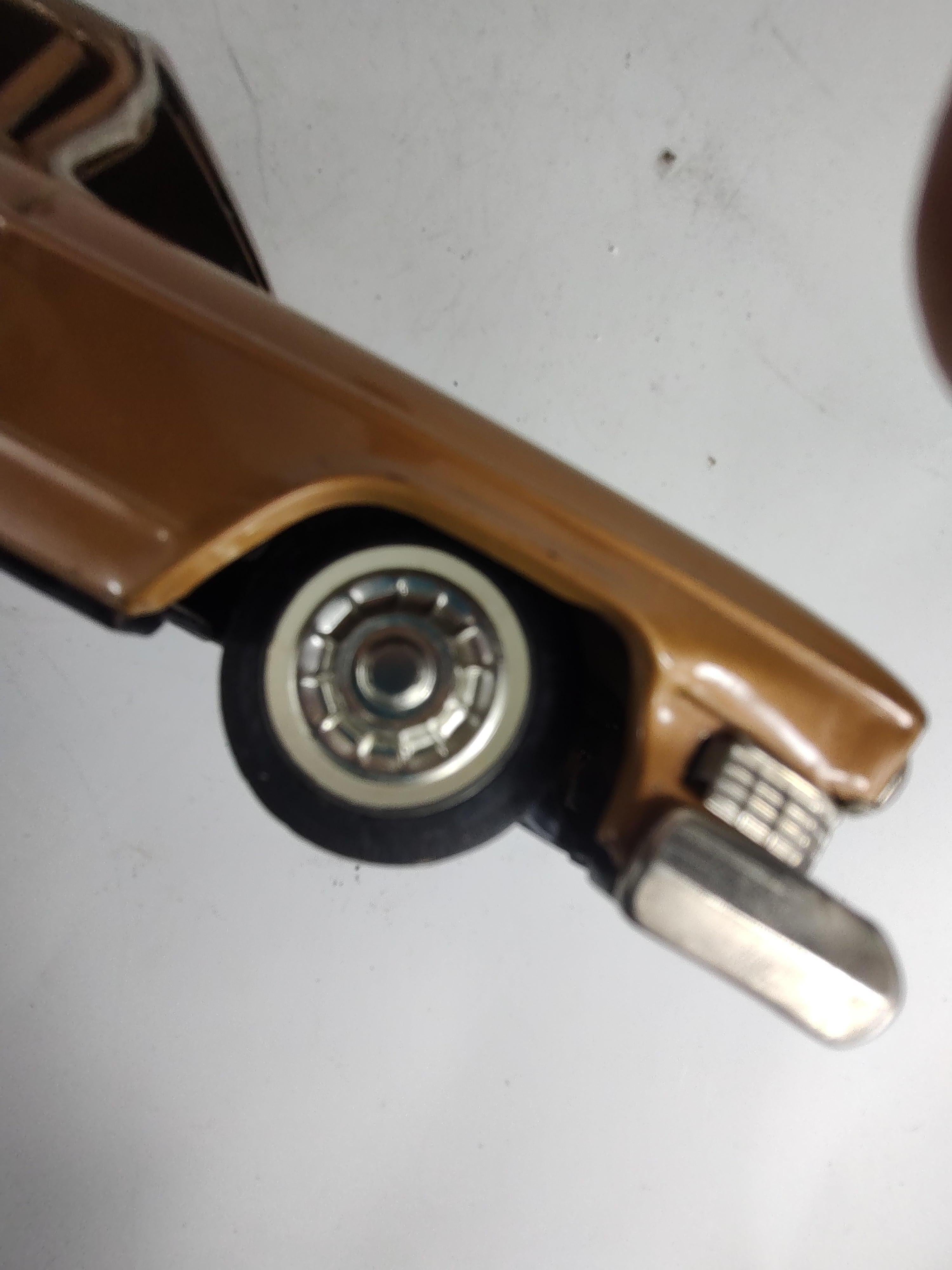 Blast from the past! 1959;Cadillac sedan de ville in gold paint with tin litho interior. Has a dent in the hood and plastic windshields need to be installed. See pics. Shows wear, friction motor works well.