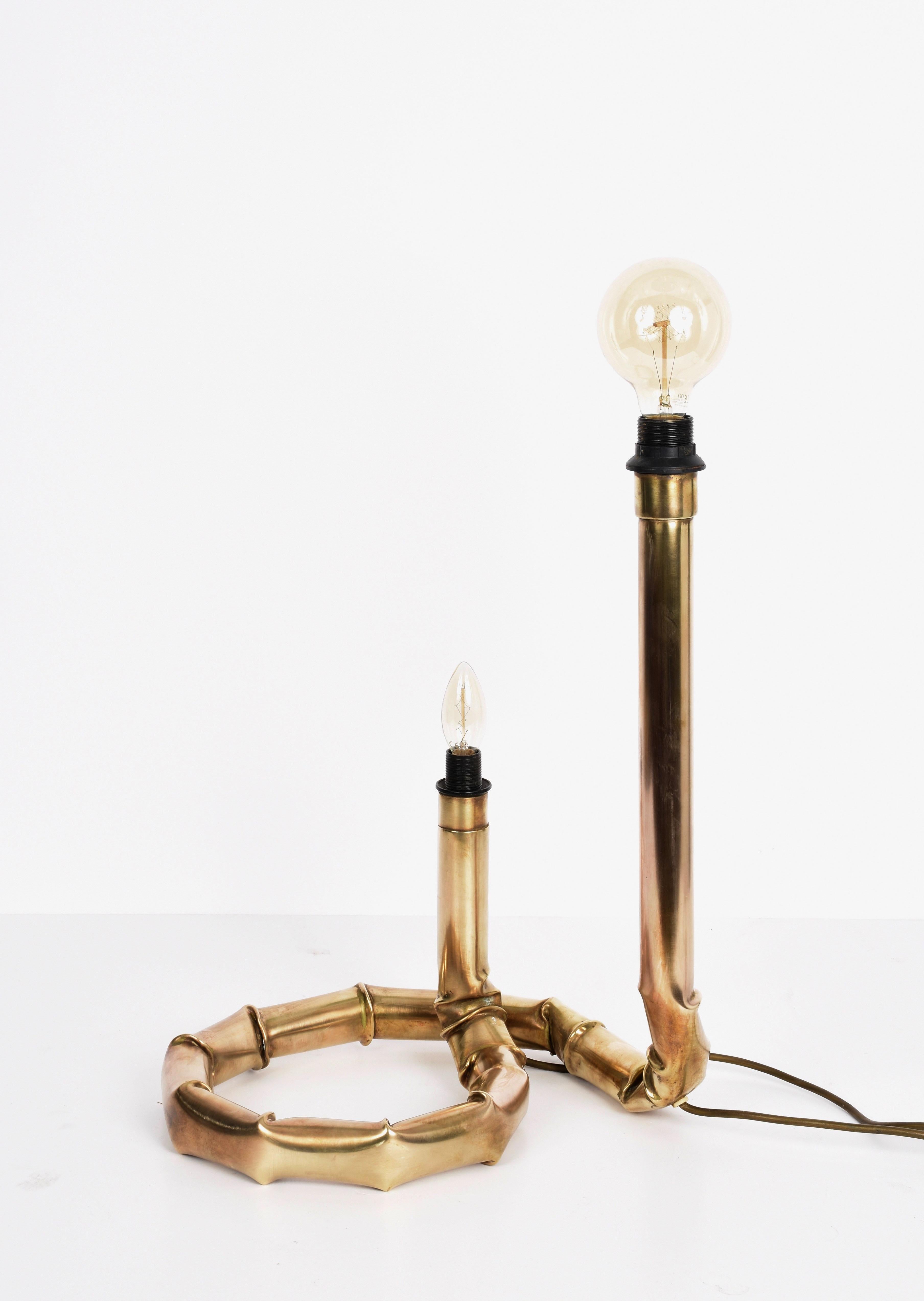 Midcentury brushed and worked brass double light table lamp. This amazing item was designed in Italy during 1960s by the master designer Tommaso Barbi.

This unique piece can be defined as a sculptured lamp because of the way the brass has been