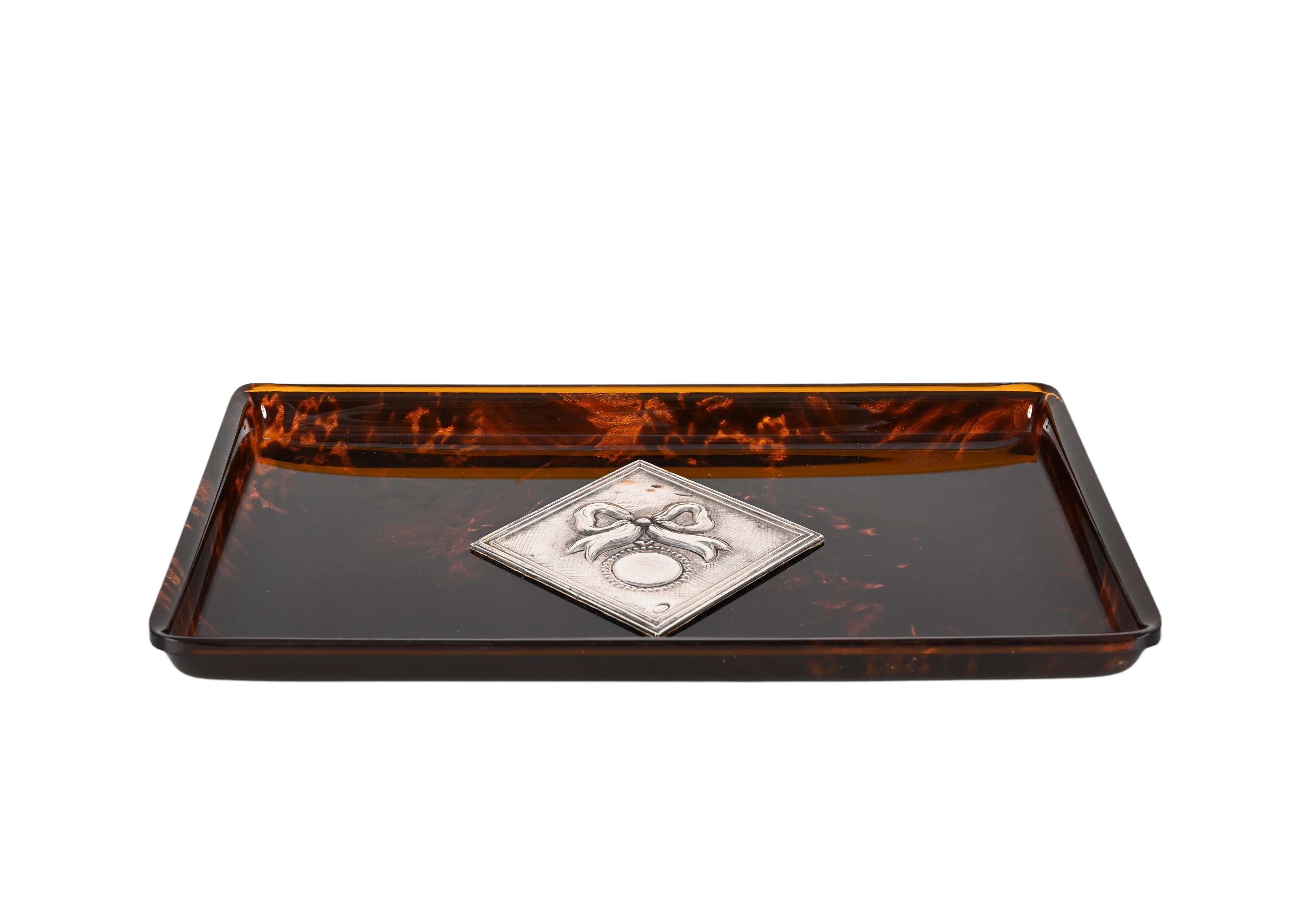 Wonderful mid-century serving tray in lucite with tortoiseshell effect and silver. This fantastic piece was designed in France following the style of Christian Dior Style during the 1970s.

This item conveys classic elegance through its lucite