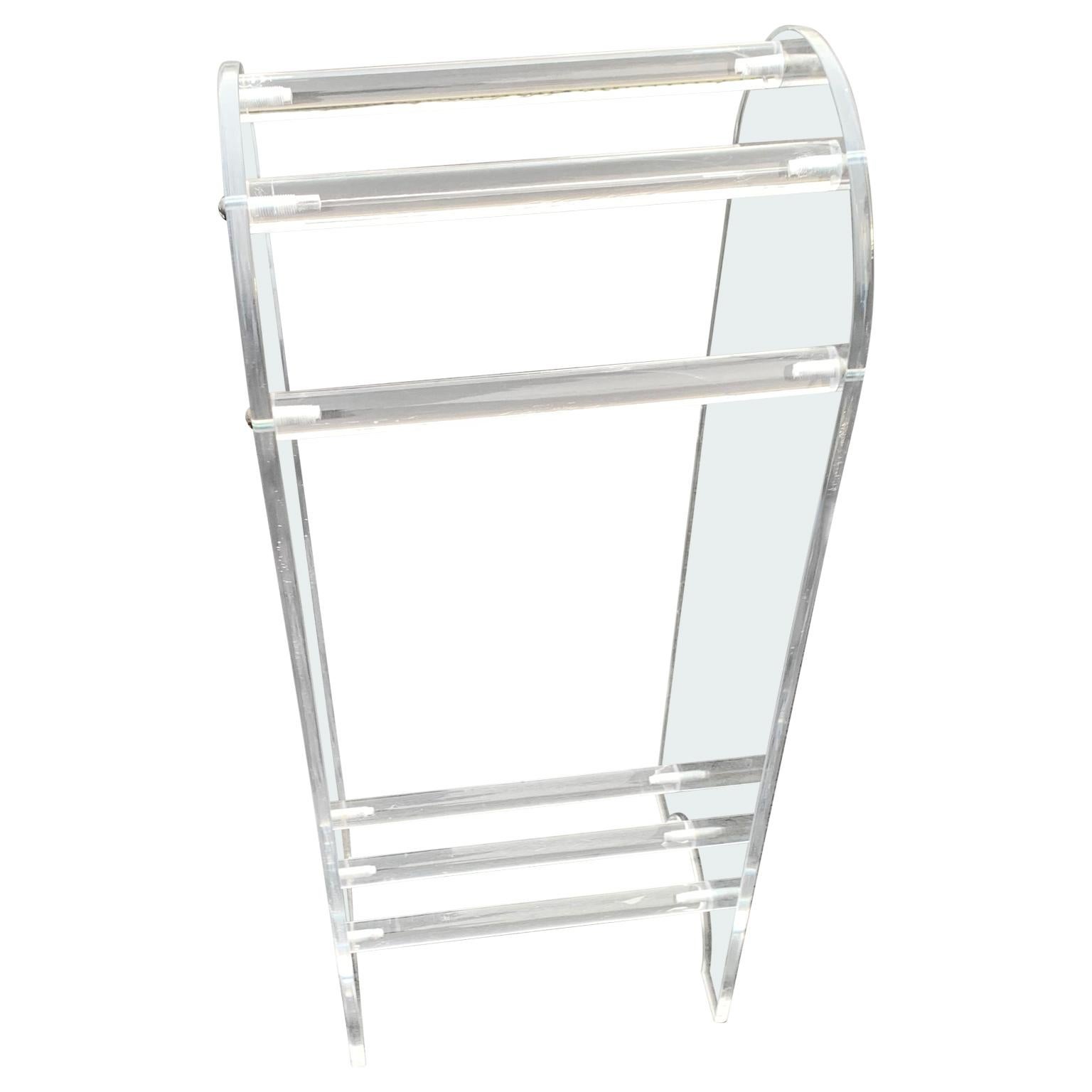 Midcentury towel rack of thick Lucite.