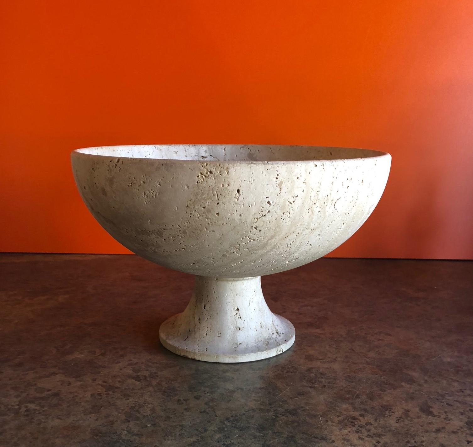 A very cool Mid-Century Modern travertine pedestal fruit bowl, circa 1970s. The bowl is 12