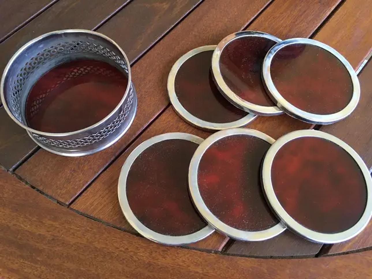  Excellent quality, Excelent conditions

-The lot consists of 3 pieces, an ice bucket a tray and 1 pack of 6 coasters. and 
1 container to hold the coasters

Nickel silver and Tortoise Shell  Lucite (acrylic)

Very good conditions, like new

 Very