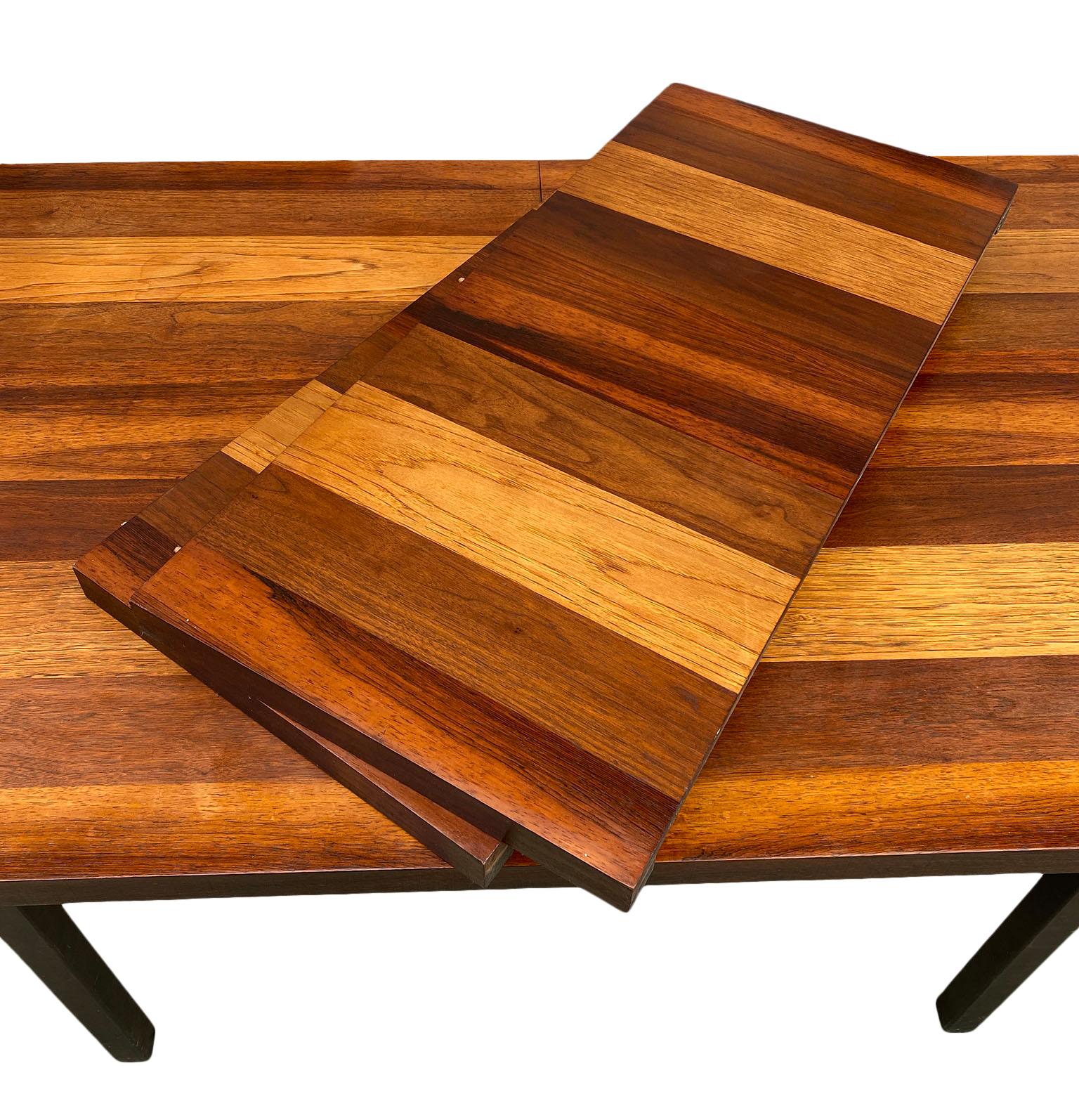 Mid-Century Modern American Danish style dining table by Milo Baughman. Beautiful tri-wood veneer table made in USA. Amazing teak, rosewood and walnut table. Made circa 1960 all black solid wood legs. Original finish in good vintage condition has 1
