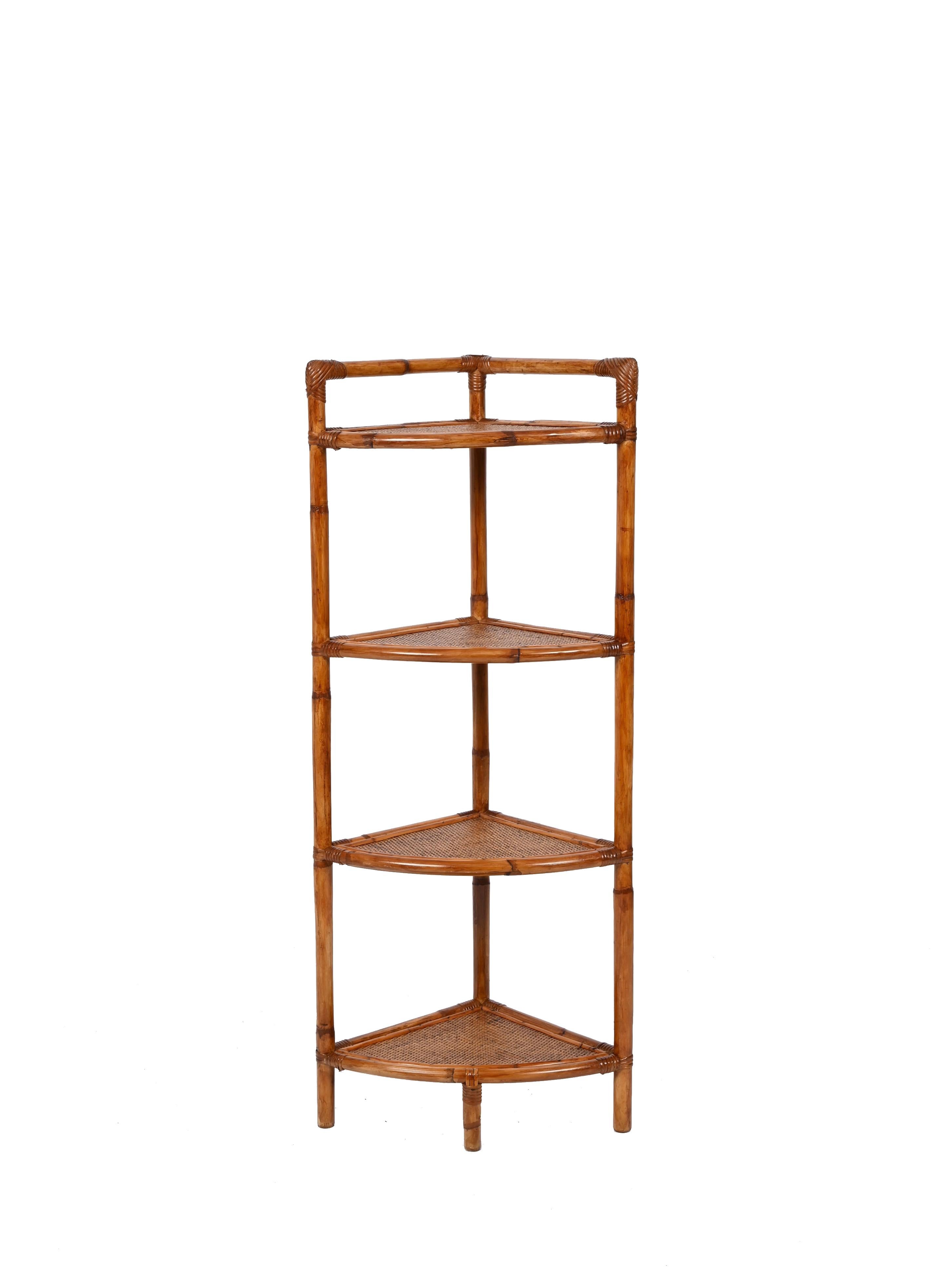 Amazing midcentury triangular bamboo and rattan corner bookcase shelves. Franco Albini inspired the design of this piece, produced is in Italy during the 1970s.

This piece is fantastic thanks to its bamboo triangular structure with stunning