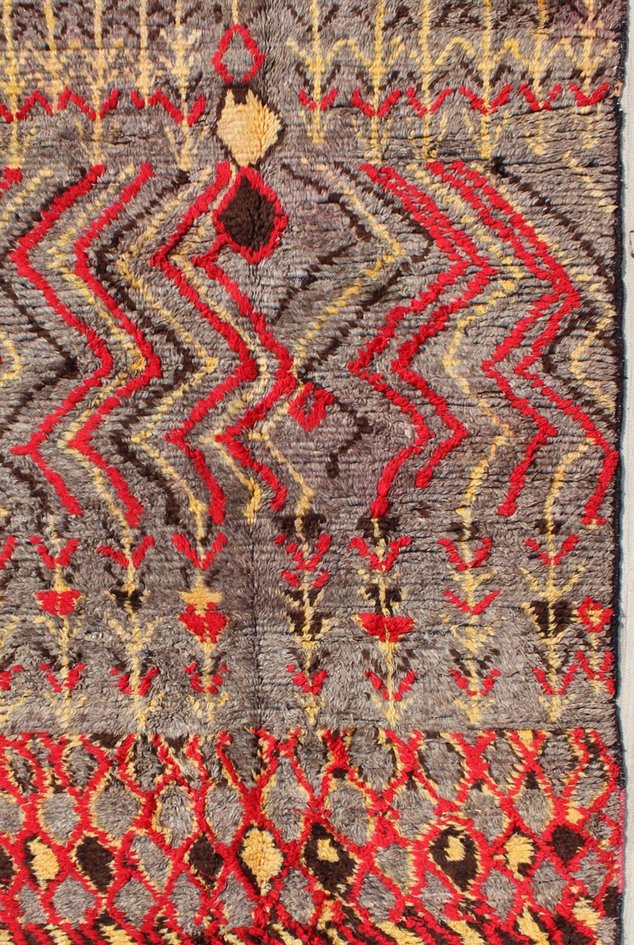 Midcentury Moroccan rug with charcoal, red, yellow, and gray. Keivan Woven Arts rug/BDS-20768, country of origin / type: Morocco / Tribal, circa mid-20th century

This wonderful vintage Moroccan rug (circa mid-20th century) features shades of red,