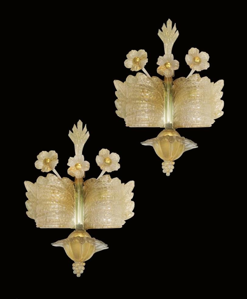 Gorgeous Trio of sconces 24-karat gold by Barovier & Toso.
Measures: The big one 105 cm height, 12 cm depth, width 35 cm
Two pair 50 cm height, 12 cm depth, width 35 cm.