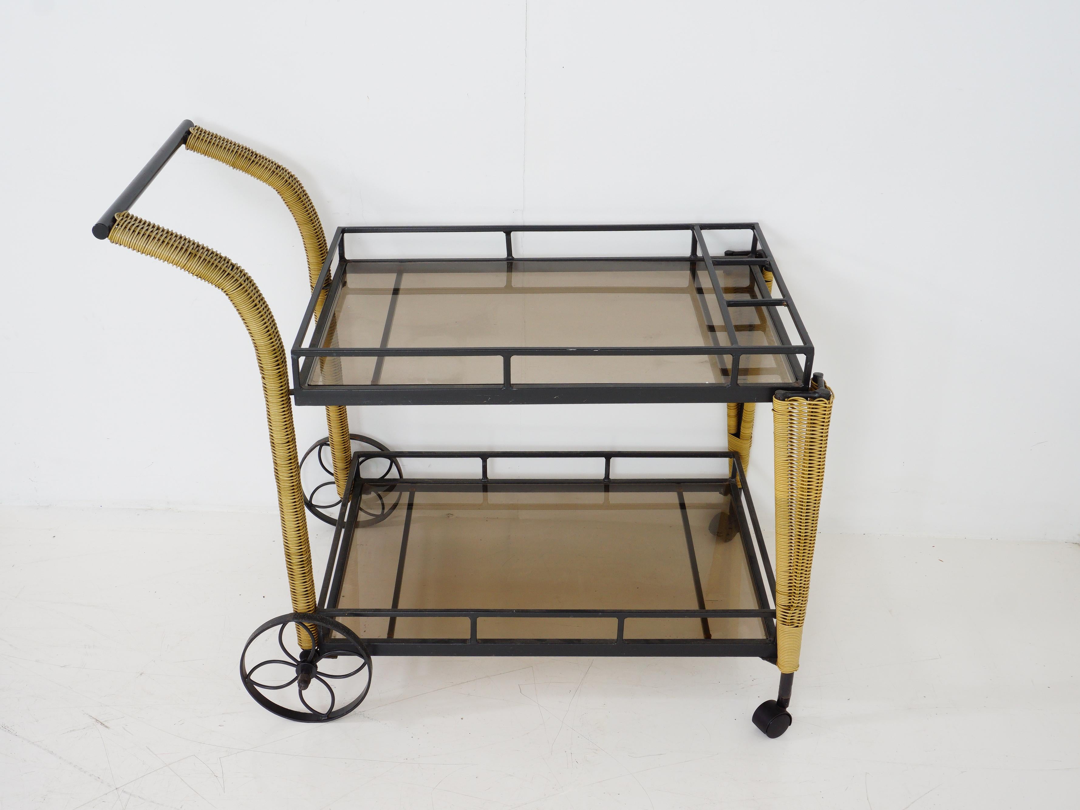 Swanky and mobile, this midcentury two-tier bar cart is the ultimate host with the most. Roll out the retro charm while you shake, stir, and serve in style.

- 35.25