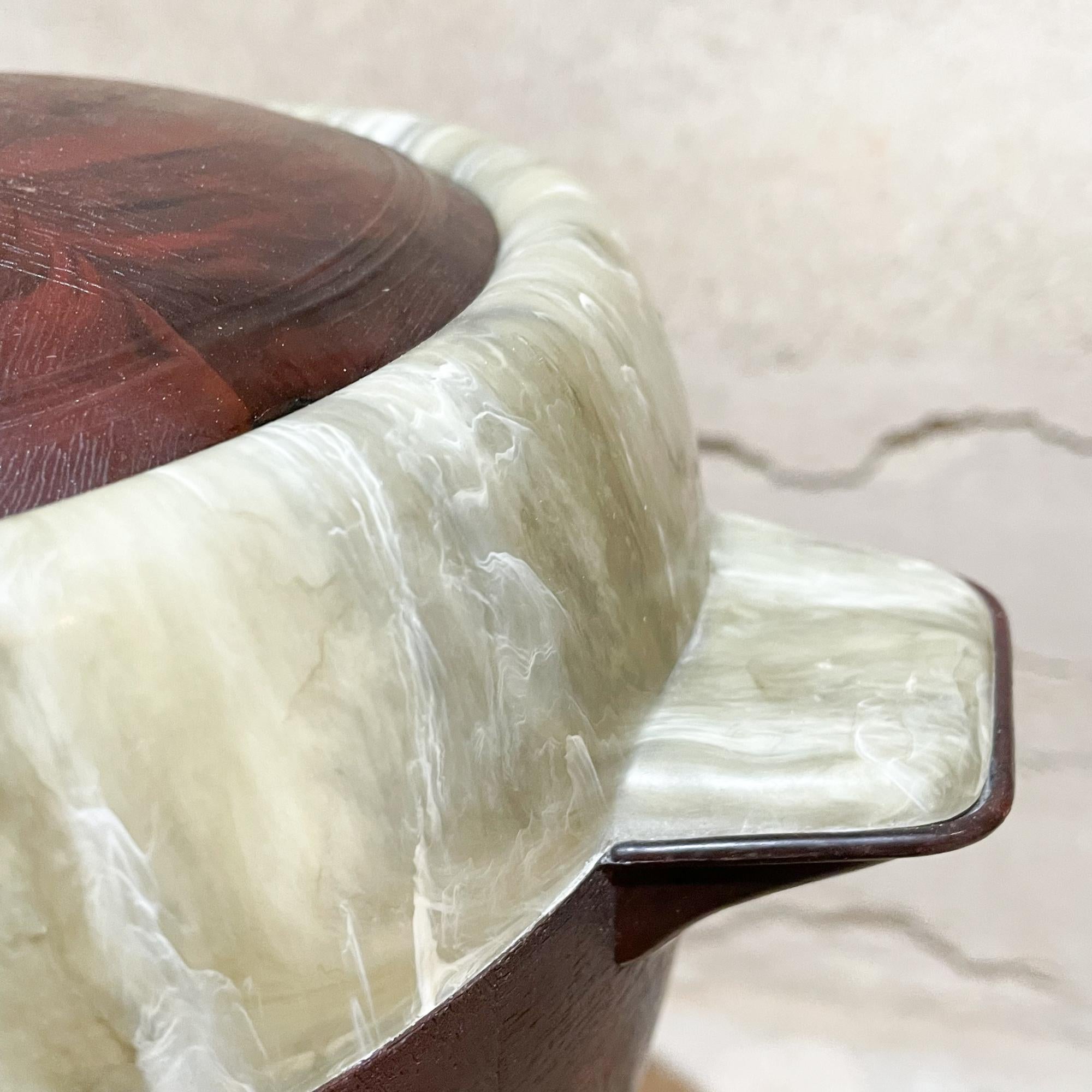 
Mexico Modernism midcentury ice bucket with brown and ivory tones interior and trim 1950s Mexico
Fabulous look of faux wood & faux stone marble interior and trim. 
Design in the style of Aldo Tura.
Material is Vinyl Plastic
Unmarked. Matching cover