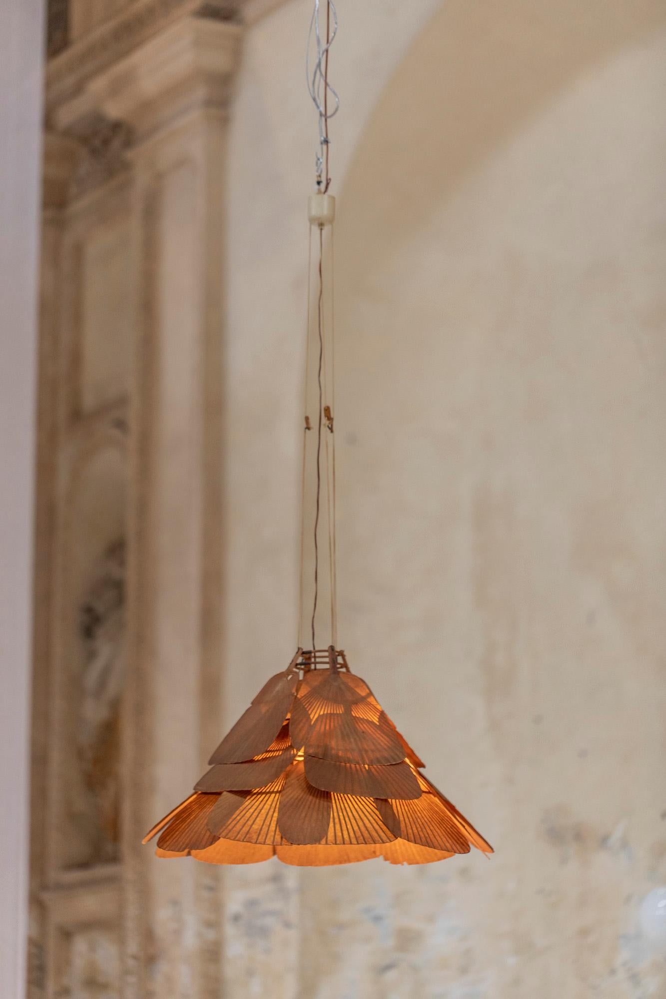Rare chandelier designed by Ingo Maurer for Design M, in 1975 in Germany. 
Poetic chandelier executed in bamboo and rice paper fans, from Uchiwa series.
Amazing brown patina.
The height is adjustable by suspension from 3 strings.