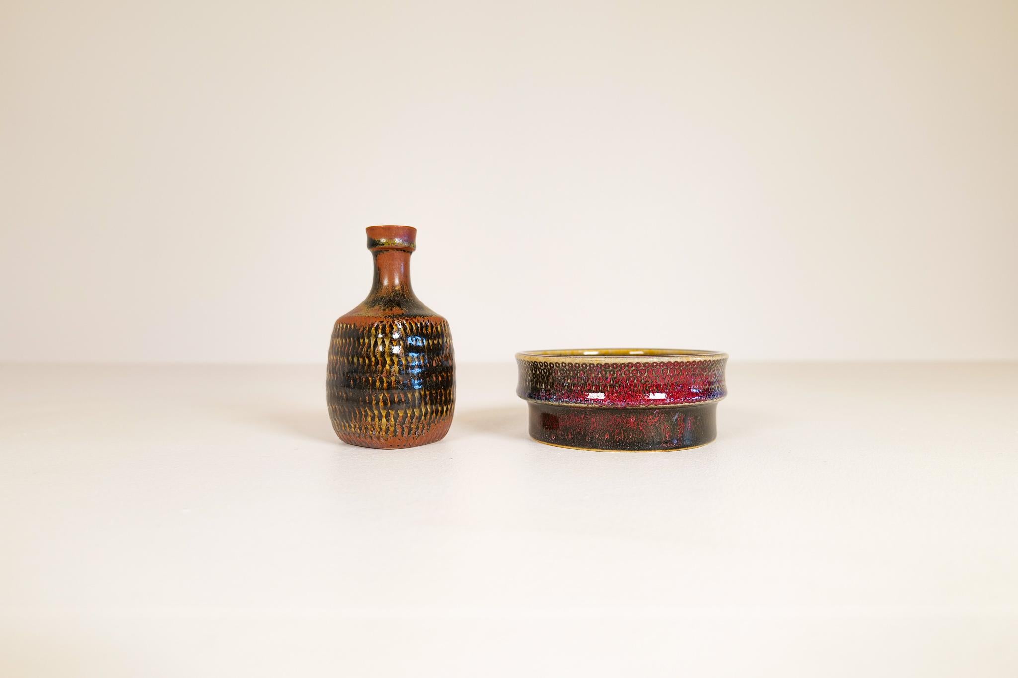 These two unique and wonderful sculptured ceramic pieces was made at Gustavberg Sweden during the 1960s and designed by famous Stig Lindberg. They both have Lindbergs signature engraved into the bottom of the ceramic together with the well-known