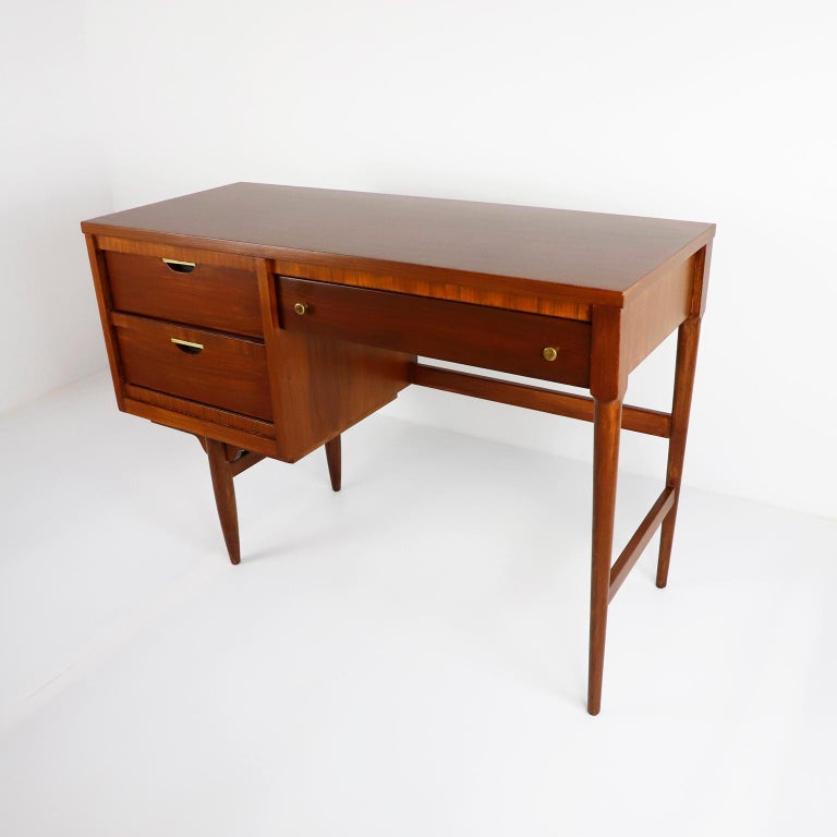 Circa 1970, we offer this Midcentury United Furniture Corporation Desk made in Walnut, recently professionally restored.