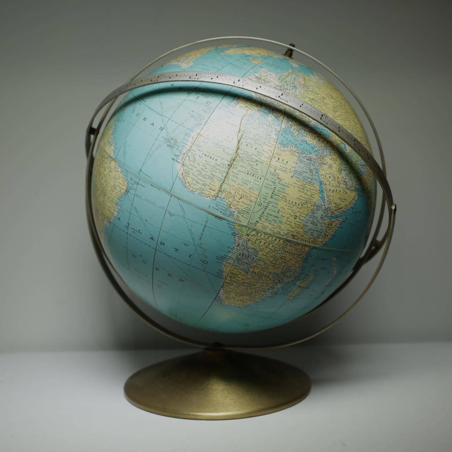 Very unusual world globe with several brackets. One bracket has the time zones and the other has the Longitude.