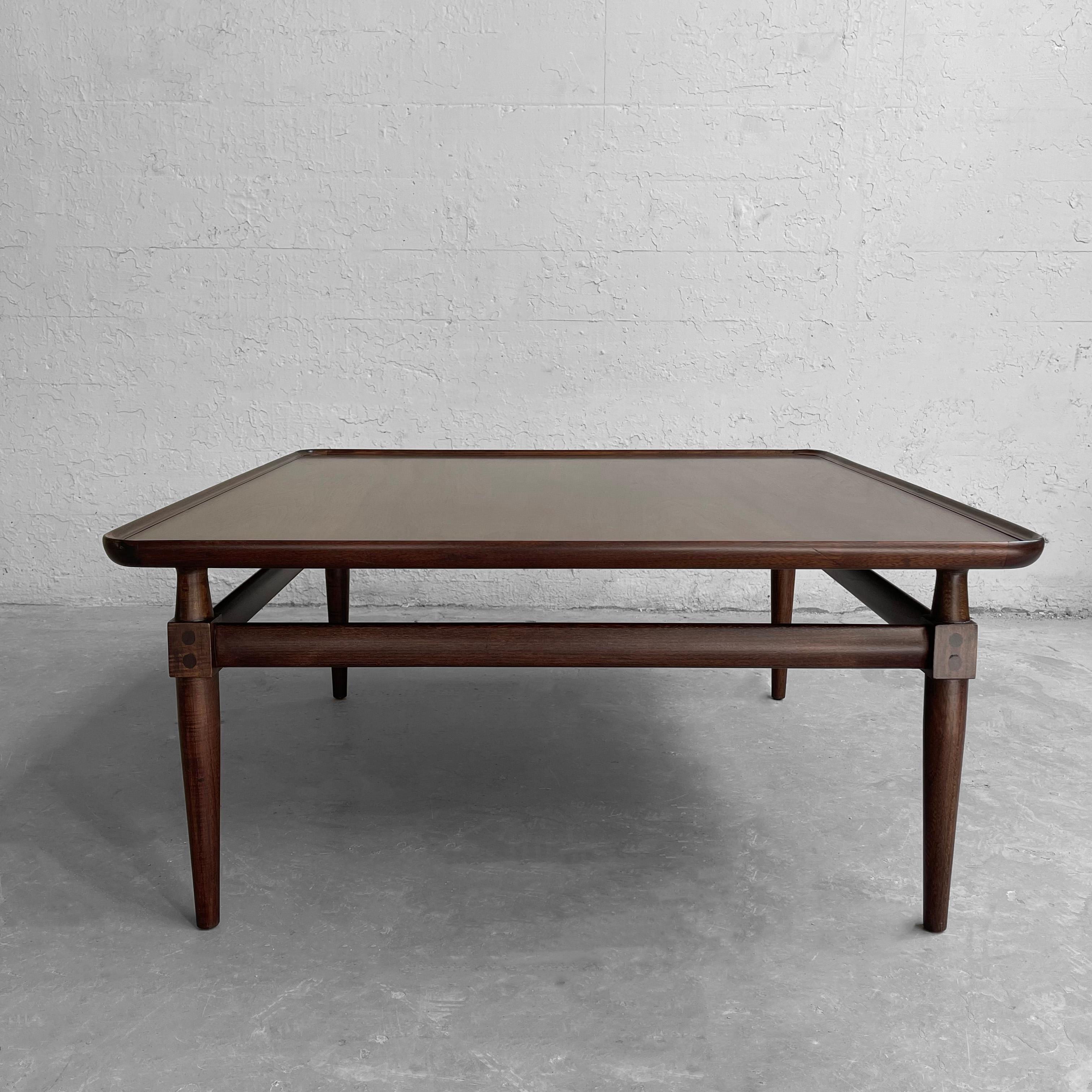 Lovely, mid-century, square, maple coffee table features upturned edges, wonderful joinery and tapered legs.