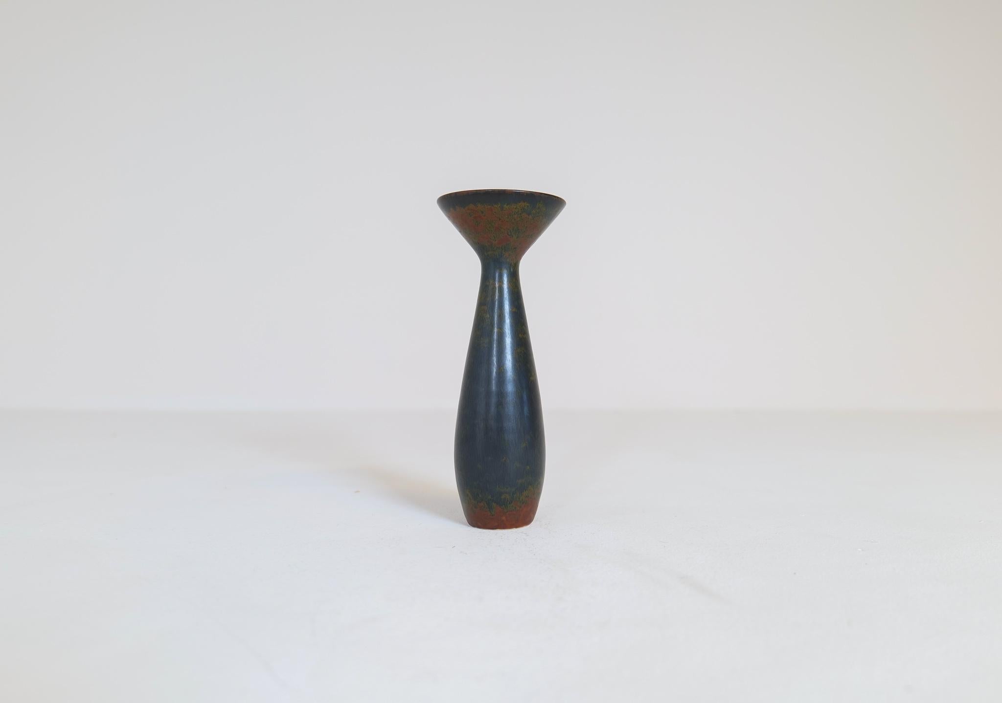 This vase from Rörstrand and maker or designer Carl Harry Stålhane, was made in Sweden in the midcentury. Its beautiful glazed combined with its incredible forms makes this an exceptional good piece. The glaze and organic shaped forms give birth to