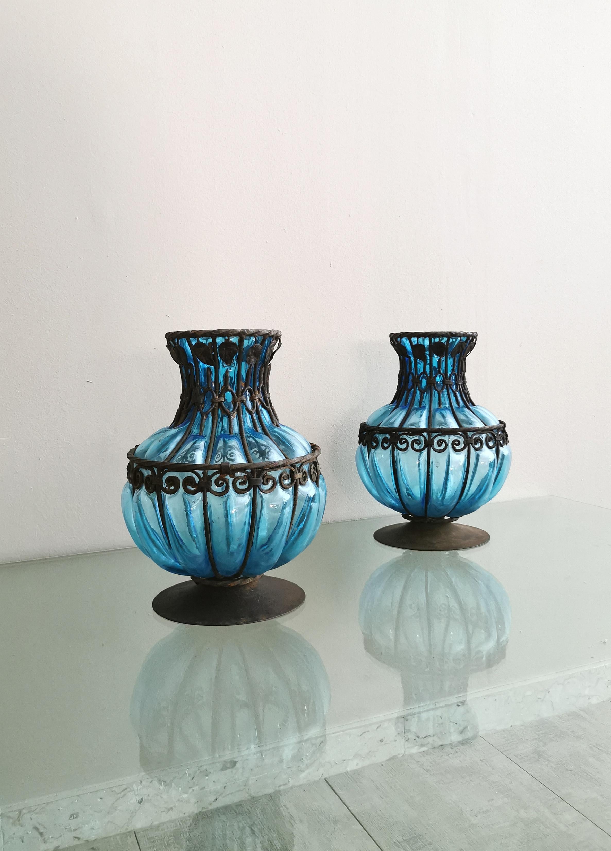 Set of 2 vases made in Italy in the 1980s. Each single vase was made of hand-made Murano glass in the shades of light blue, 