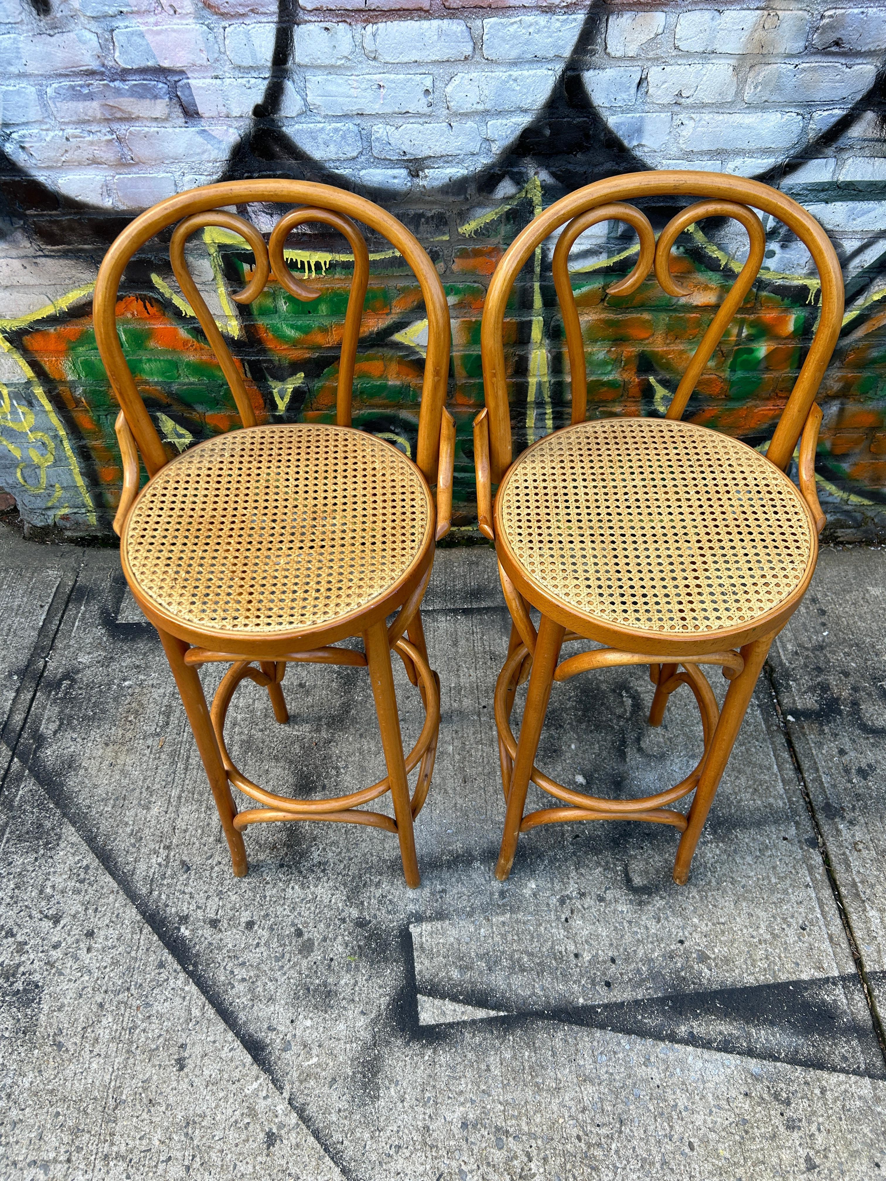 Midcentury cane round bar height stools by Thonet blonde bentwood with light cane. Seat height is 30” high. Great vintage condition. Cane is perfect on both stools. Very sturdy and ready for use. Located in Brooklyn NYC

Sold as 2 stools (1)