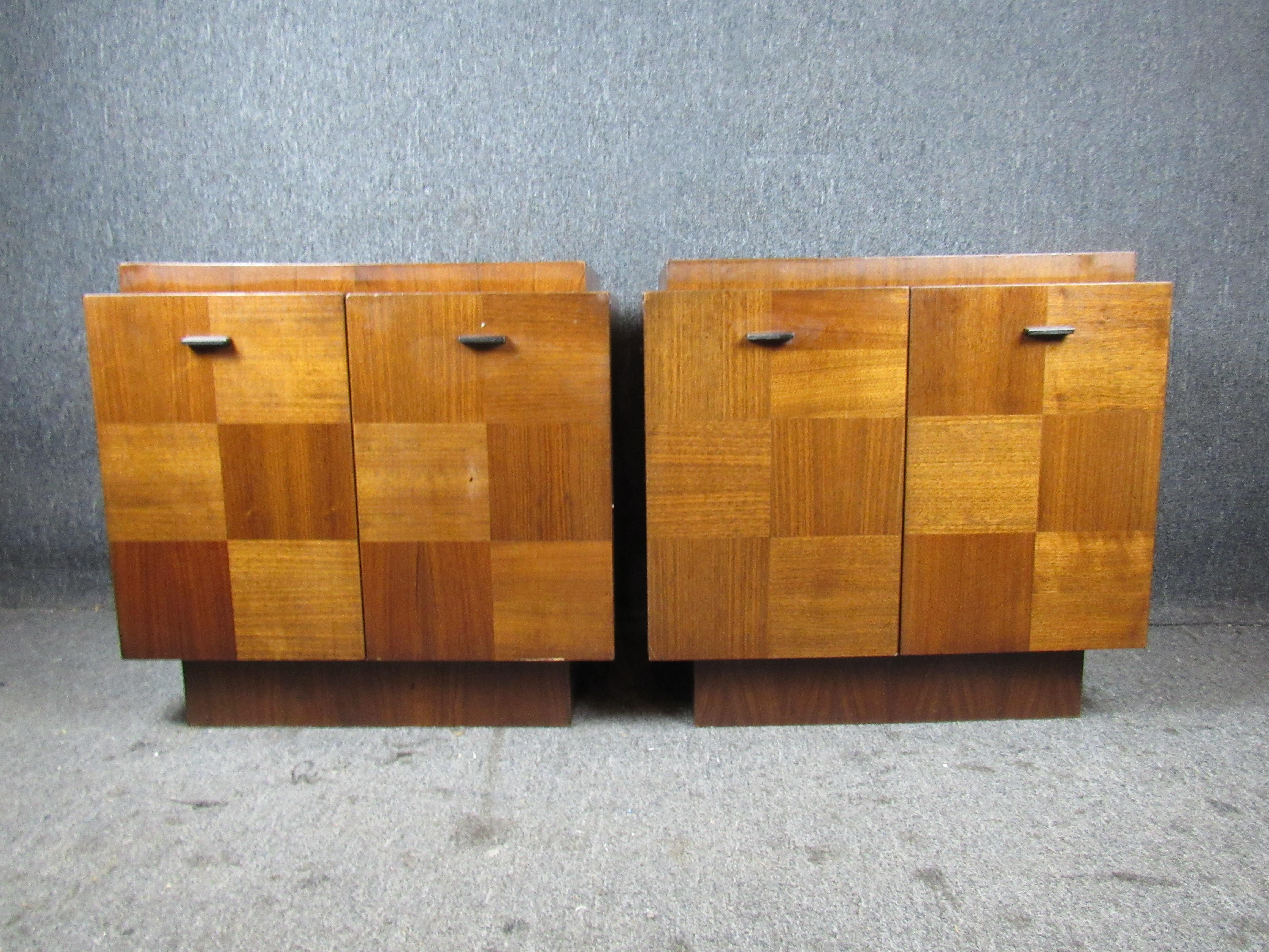 Robust nightstands from Canada's Mid-Century Modern masters at Tabago Furniture. Featuring checkered walnut and oak veneers and showcasing a subtle Brutalist design, the double doors open to reveal ample case storage, perfect for vinyl records,