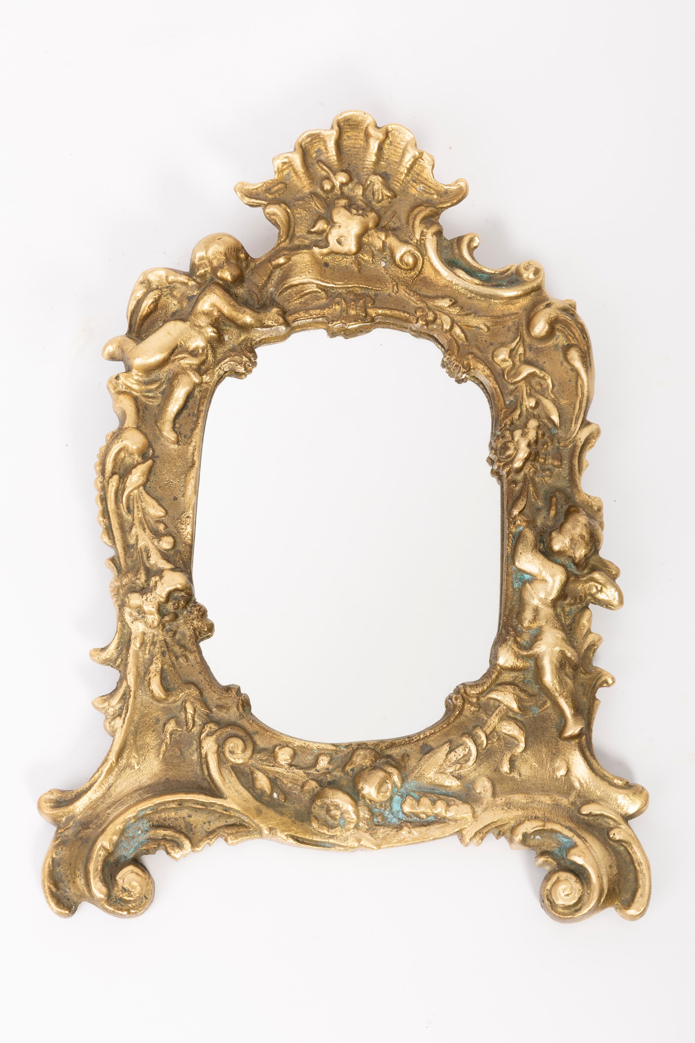 A mirror in a golden decorative frame from Italy. The frame is made of metal. Mirror is in very good vintage condition, no damage or cracks in the frame. Original glass. Beautiful piece for every interior! Only one unique piece.