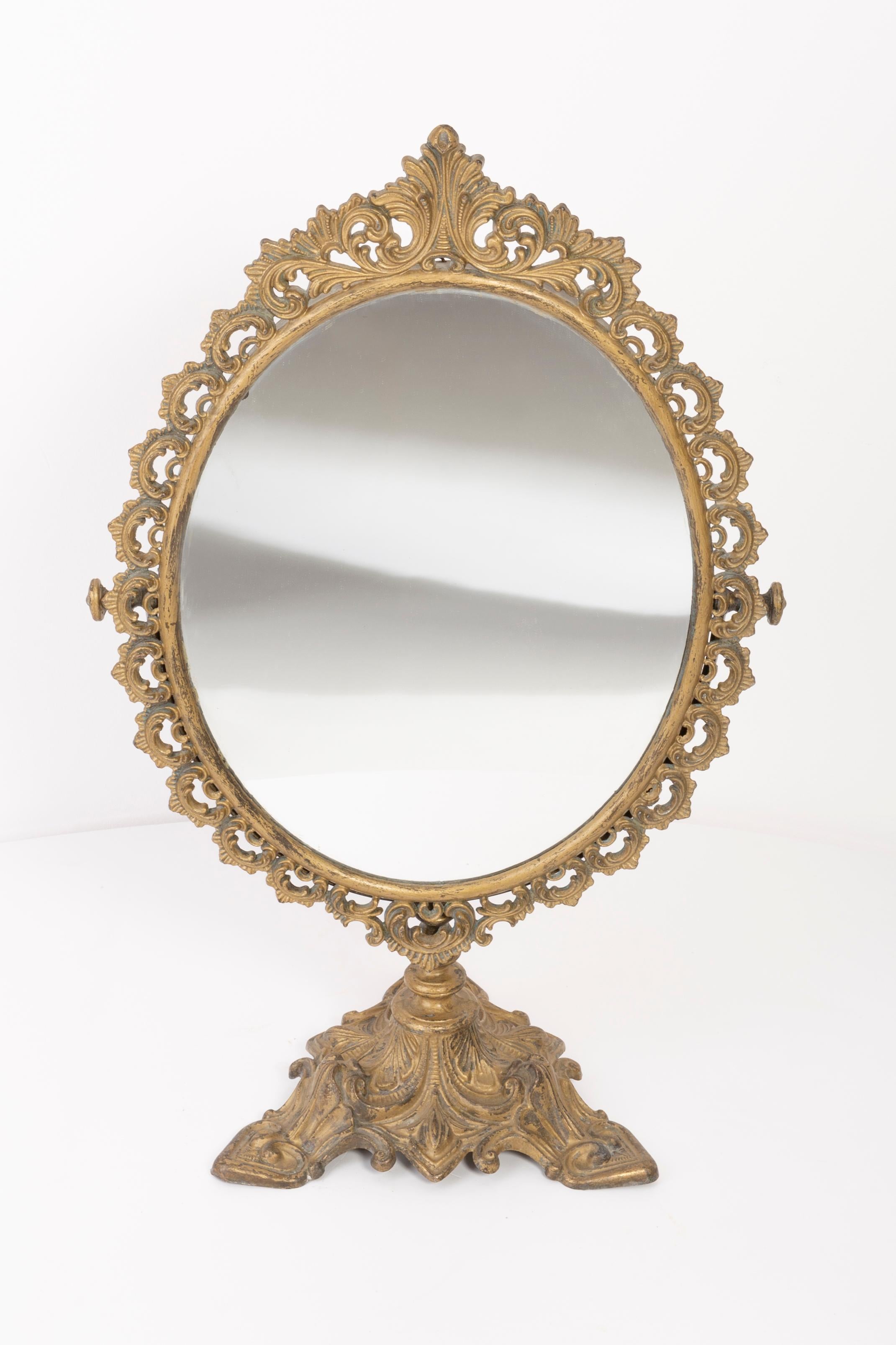 A mirror in a golden decorative frame from Italy. The frame is made of metal. Mirror is in very good vintage condition, no damage or cracks in the frame. Original glass. Beautiful piece for every interior! Only one unique piece.