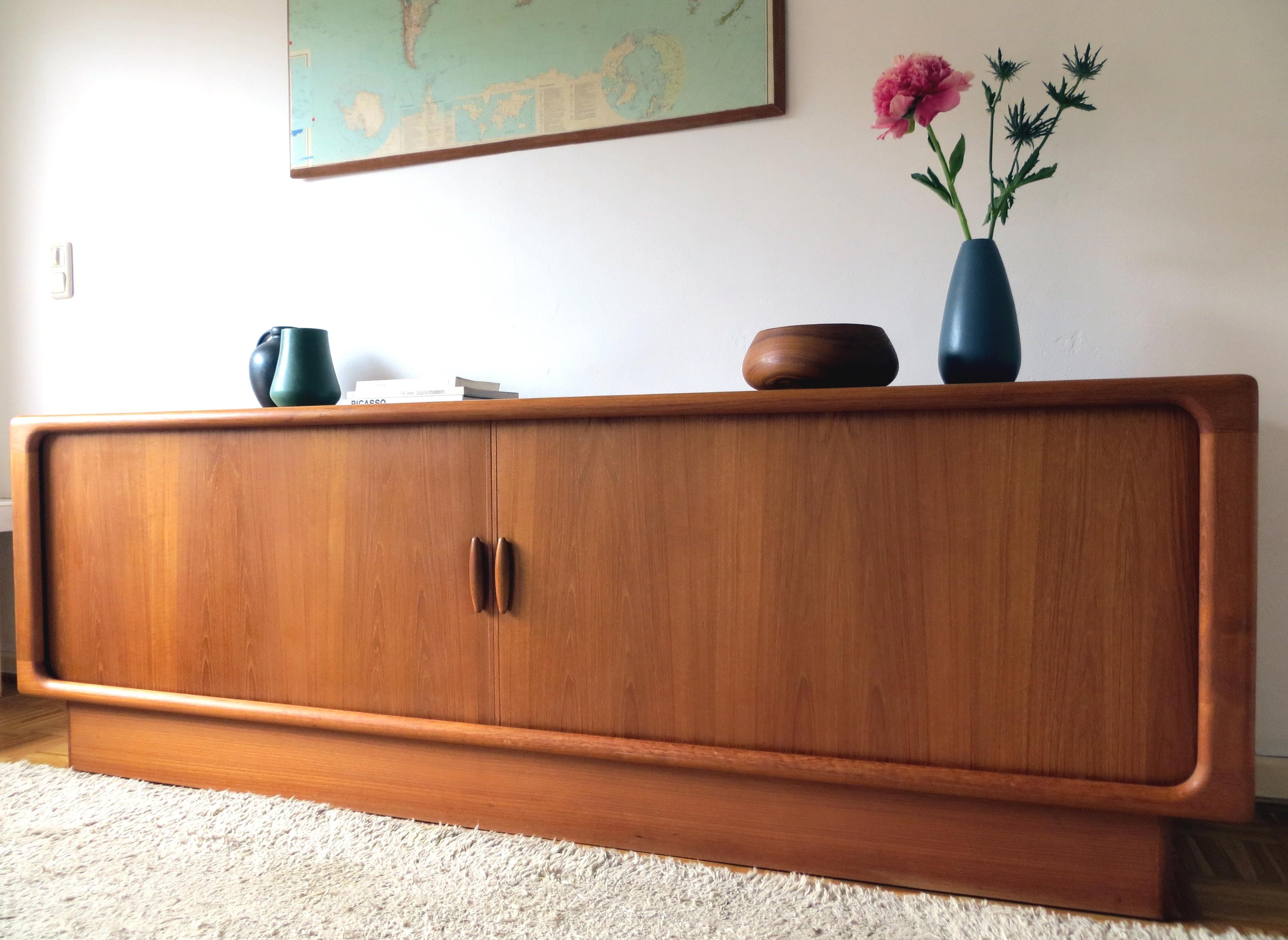 This Danish Scandinavian vintage jewel was designed in the early 1960s by Dyrlund in Denmark. This Dyrlund sideboard have the rare excess length from 87 inches.
The character of this design is clean with sculptural lines in typical highest Dyrlund