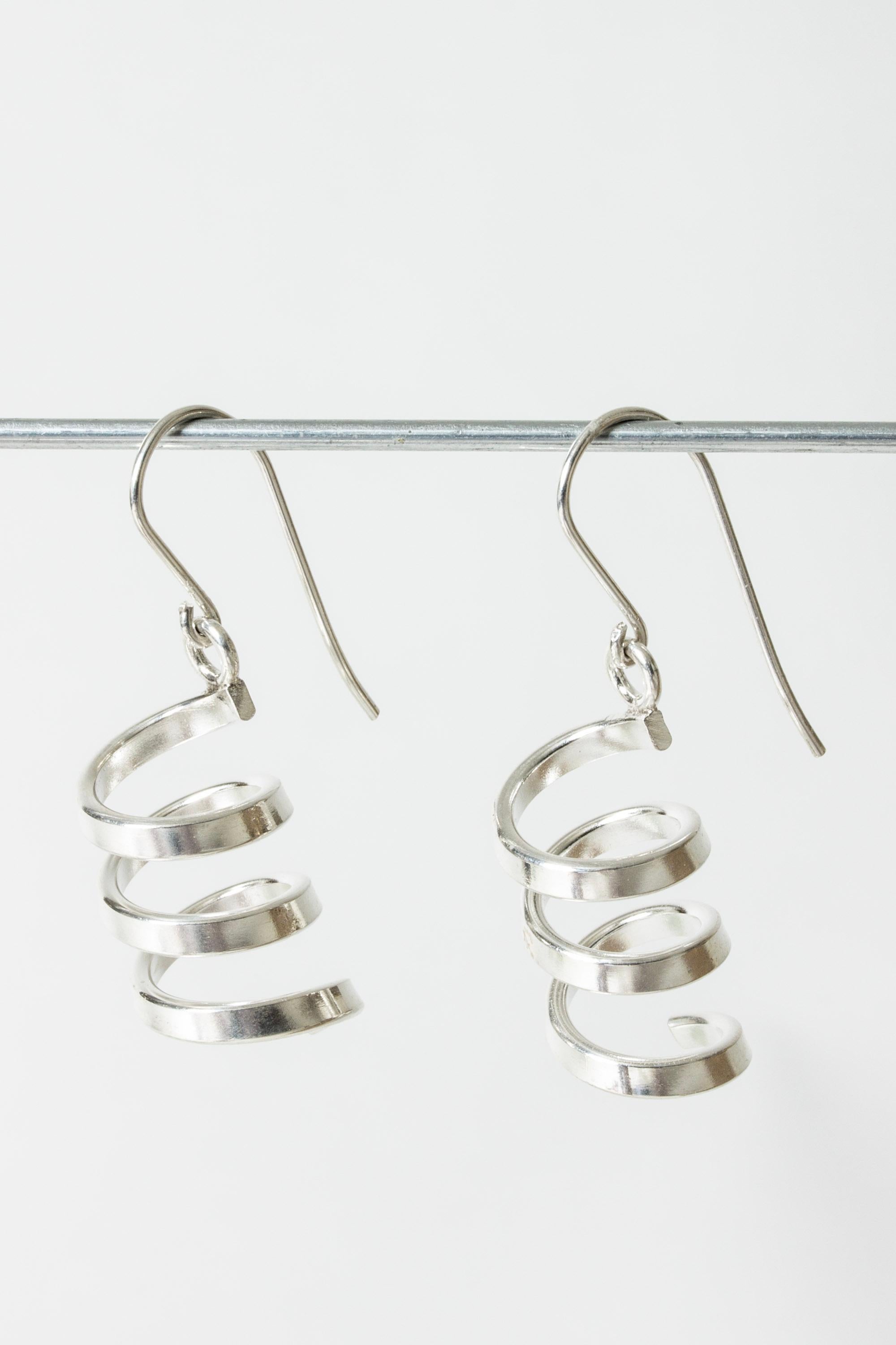 Pair of beautiful silver earrings by Cecilia Johansson, in a vivacious, bouncy spiral design.

