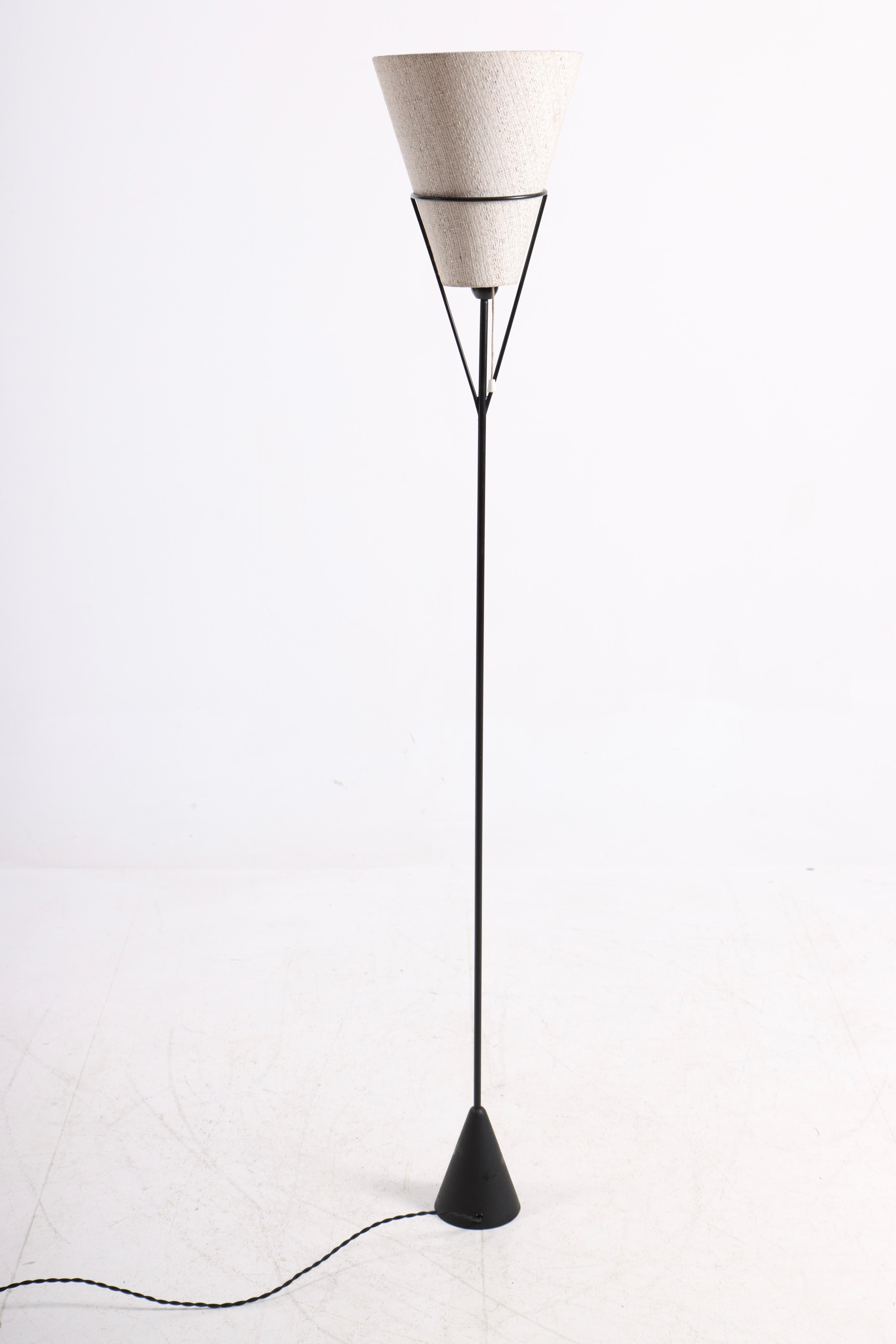 Floor lamp in patinated iron. Made in Denmark in the 1950s. Original condition.