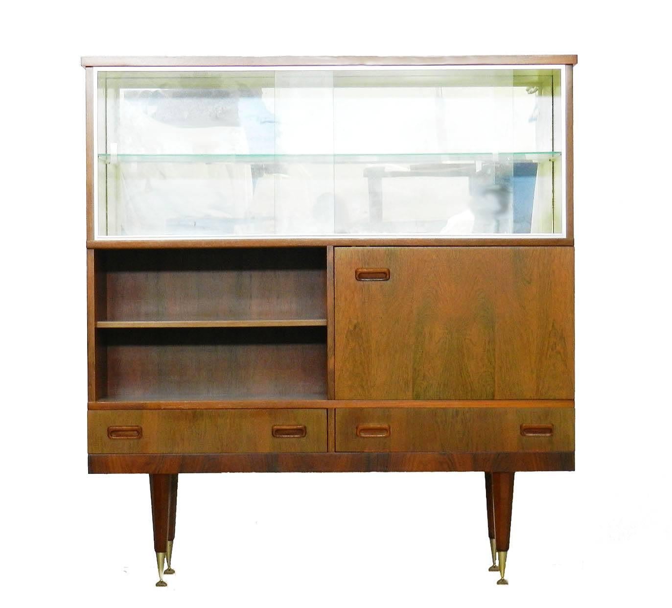 Midcentury vitrine cabinet showcase Scandinavian style
Two drawers
Shelves
Cupboard
Sliding glass display vitrine
Very good vintage condition for its age.
Free Shipping Options available 
We will always do our best to offer free shipping or at the