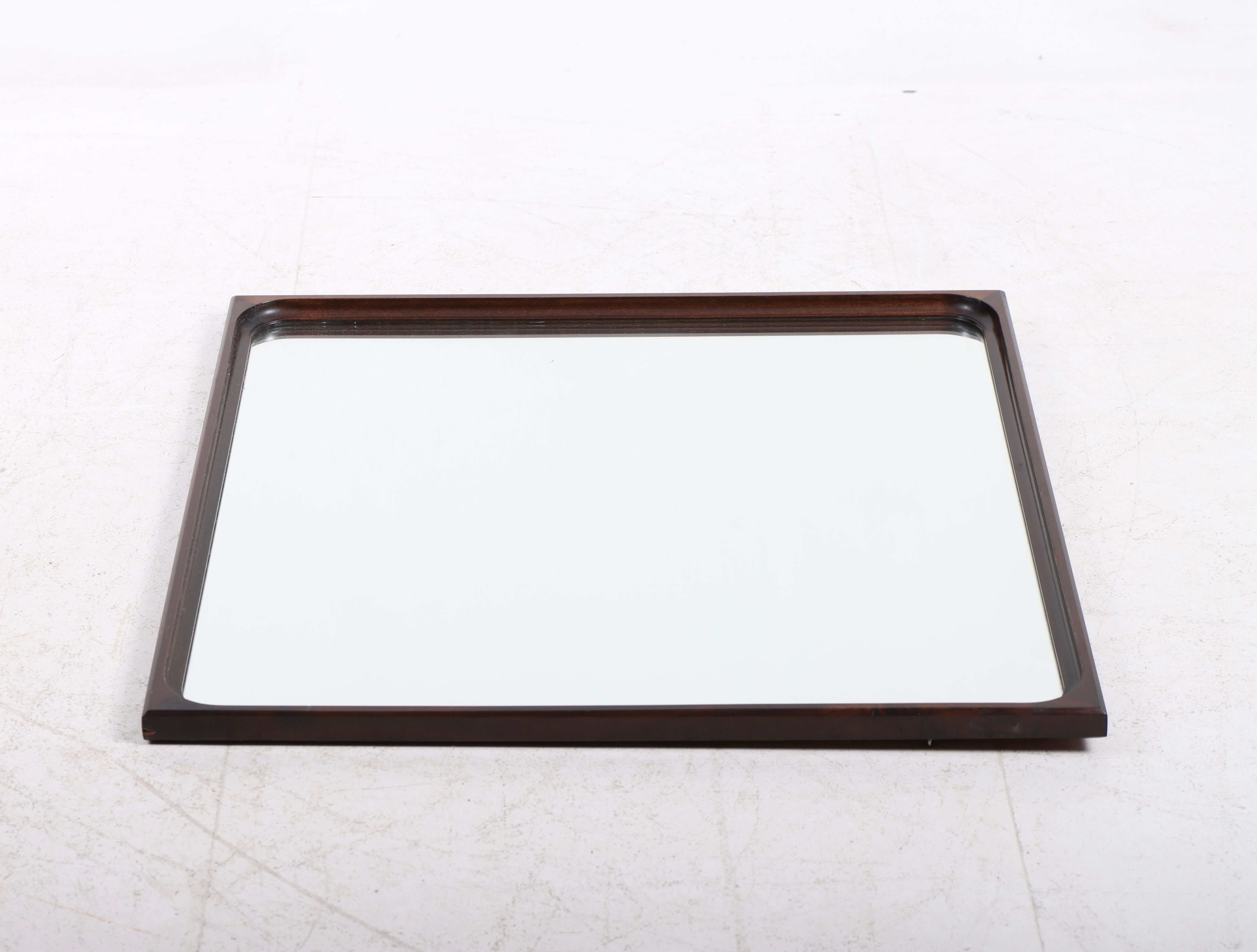 Wall mirror with frame in mahogany. Designed and made by Frode Holm. Great original condition, circa 1960.