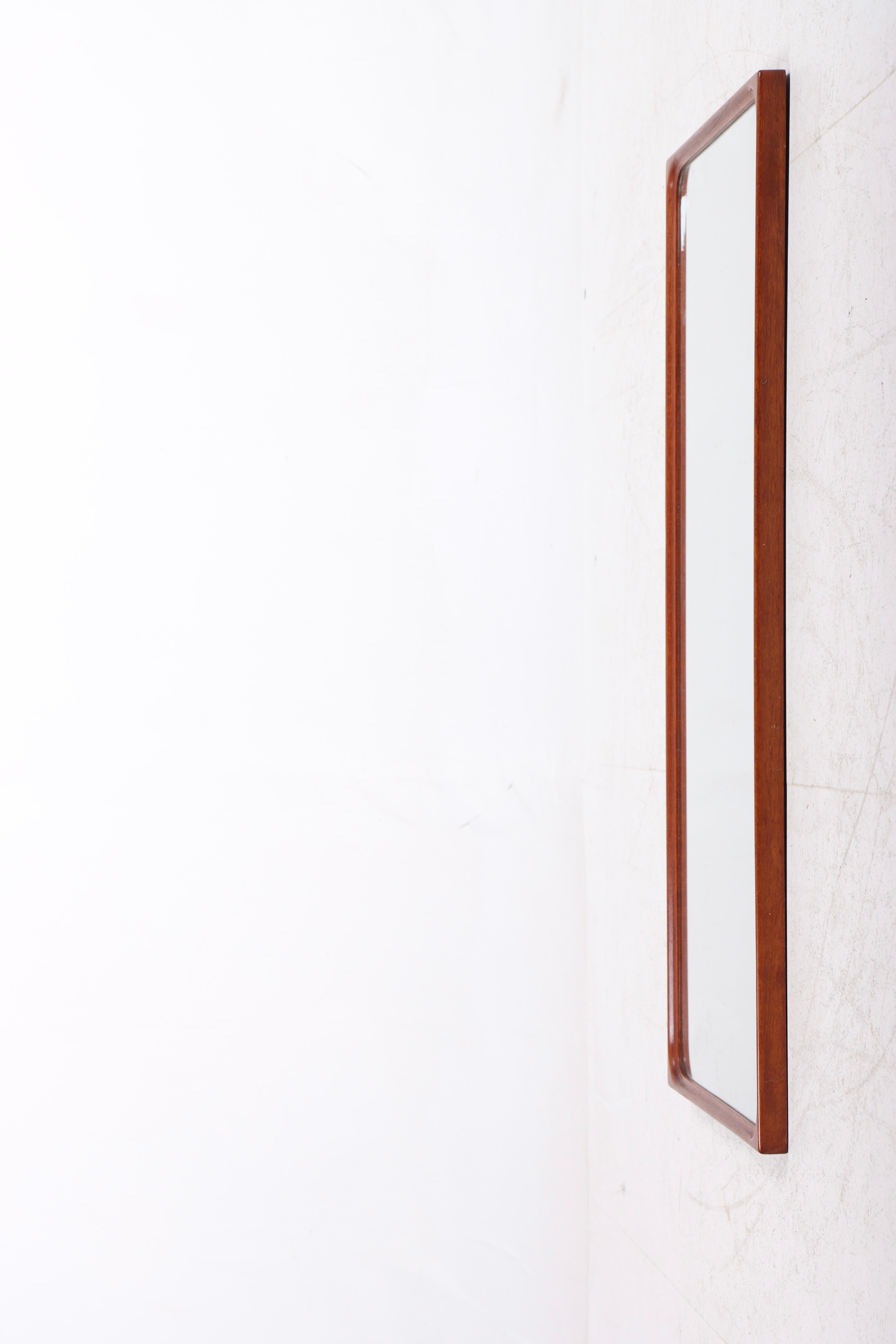 Wall mirror with frame in teak. Designed and made by cabinetmaker K. Thomsen. Great original condition, circa 1960.