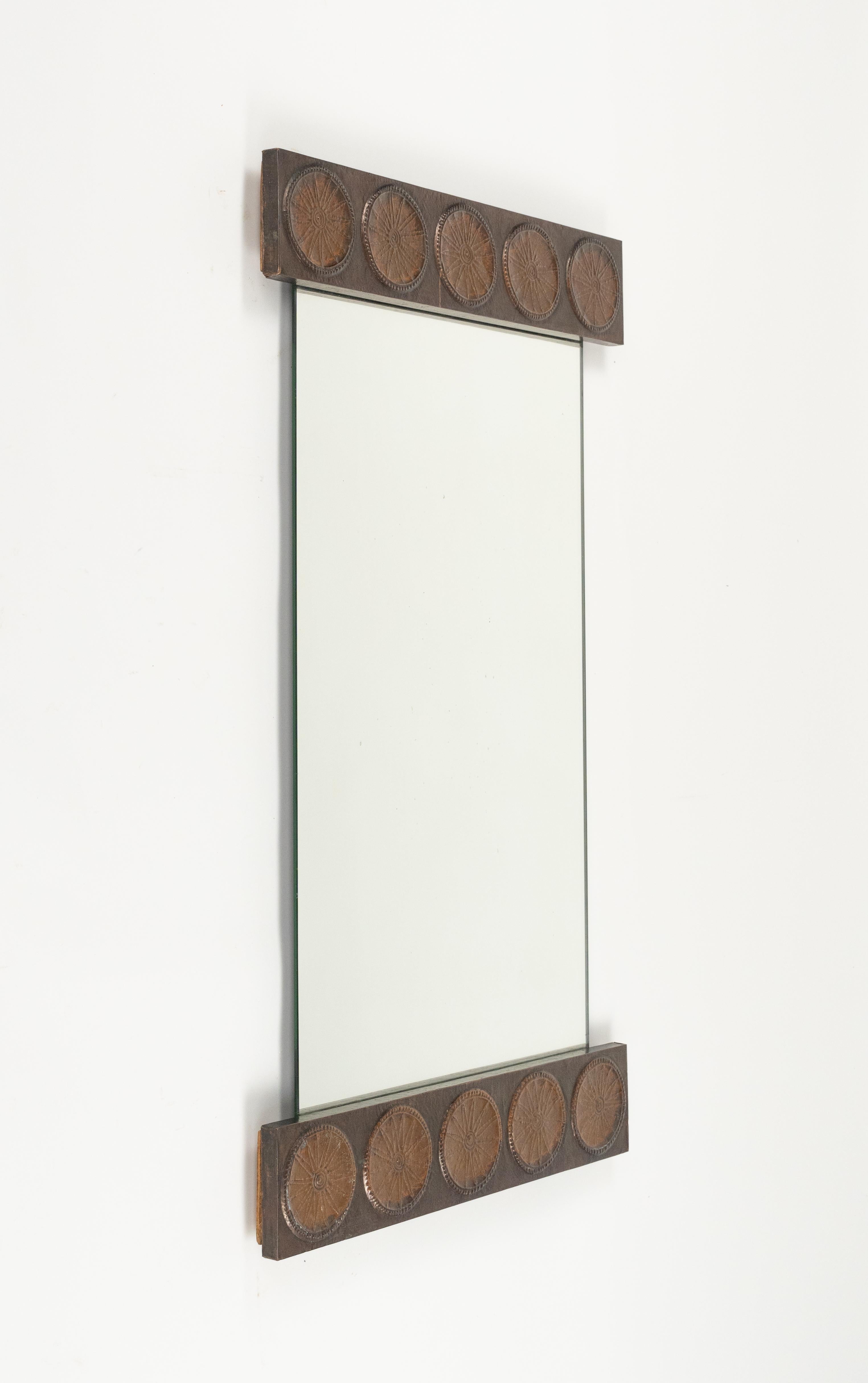 Midcentury amazing rectangular wall mirror in embossed copper decoration on the upper and lower part by Santambrogio & De Berti.  

Made in Italy in the 1960s.  

The original label is still attached on the back, as shown in the pictures.