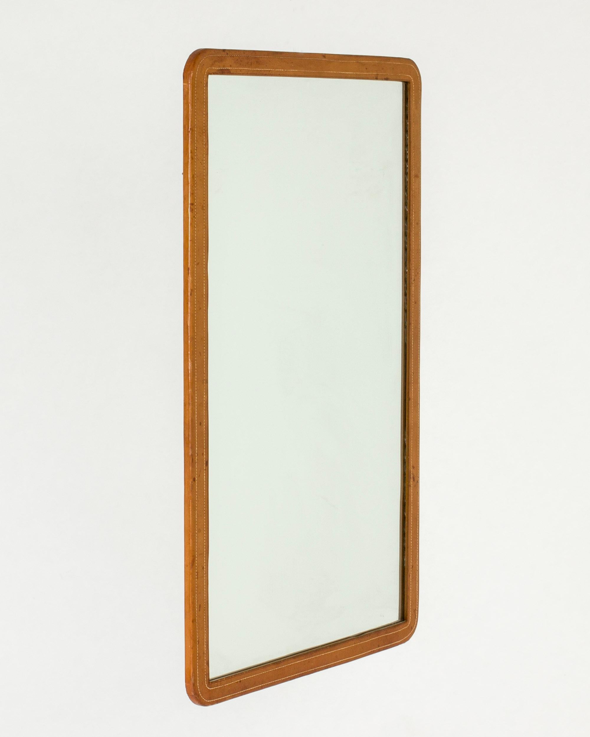 Swedish Midcentury wall mirror with leather frame, NK, Sweden, 1946