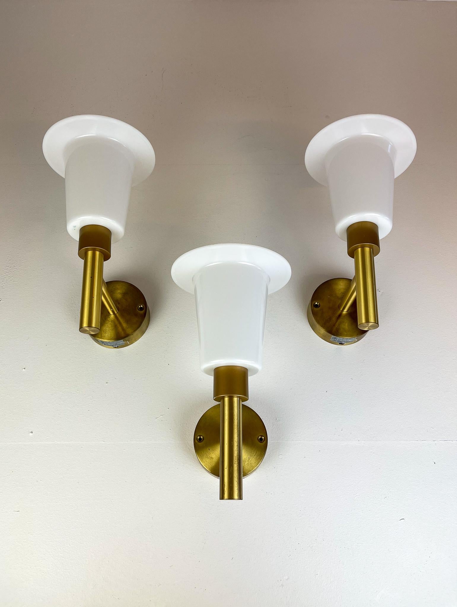 This nice-looking wall-mounted lamps was made at luxus Sweden in the 1960s. They are made in brass with an acrylic shade. 

Good vintage condition with some wear and scratches. 

Measures: H 35, W 16 cm, D 25 cm.
 